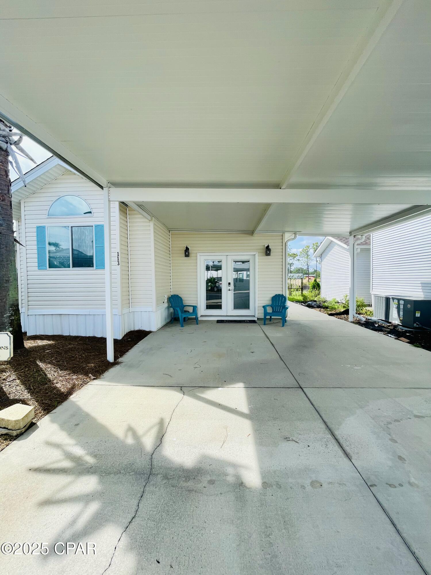 Welcome to Emerald Pointe Resort. This 3 bedroom 2 bath home has been updated with an added addition with a large living room and bedroom. One owner and very well maintained. The home has a covered awning for parking of two vehicles, a storage building behind the house and an outdoor shower great to use after a day at the beach. Emerald Pointe Resort is a golf cart friendly, gated community  located in the heart of Panama City Beach close to restaurants, shopping and the world's most beautiful beaches. 3 miles from St. Andrews State Park. Amenities include 2 pools (one heated seasonally), hot tub, large clubhouse, exercise room, lake with boardwalk and shuffleboard court. HOA fee includes water, sewer, garbage, High speed internet and lawn service. Call for a showing today. All information including age, square footage, lot and room sizes approximate. Verify if important.