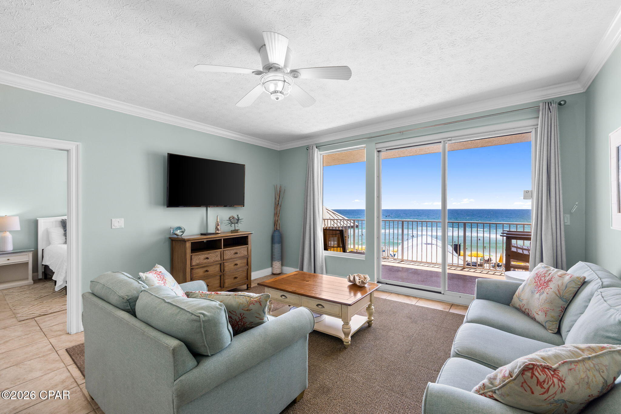 Welcome to Treasure Island! This beautifully maintained 2-bedroom, 2-bathroom condominium with hallway bunks offers the perfect blend of comfort and coastal living. Inside, you'll find tile flooring throughout and recessed lighting, creating a bright and inviting atmosphere. The open-concept floor plan provides ample space for entertaining while still allowing guests their own privacy. The spacious kitchen features a large breakfast bar that seamlessly flows into the living area. Step outside and enjoy the oversized balcony, accessible from both the living room and the primary bedroom, offering the perfect place to relax and unwind. The primary suite boasts a double vanity, walk-in shower, and a generous walk-in closet. Additional features include a private laundry room, making this unit as convenient as it is charming.