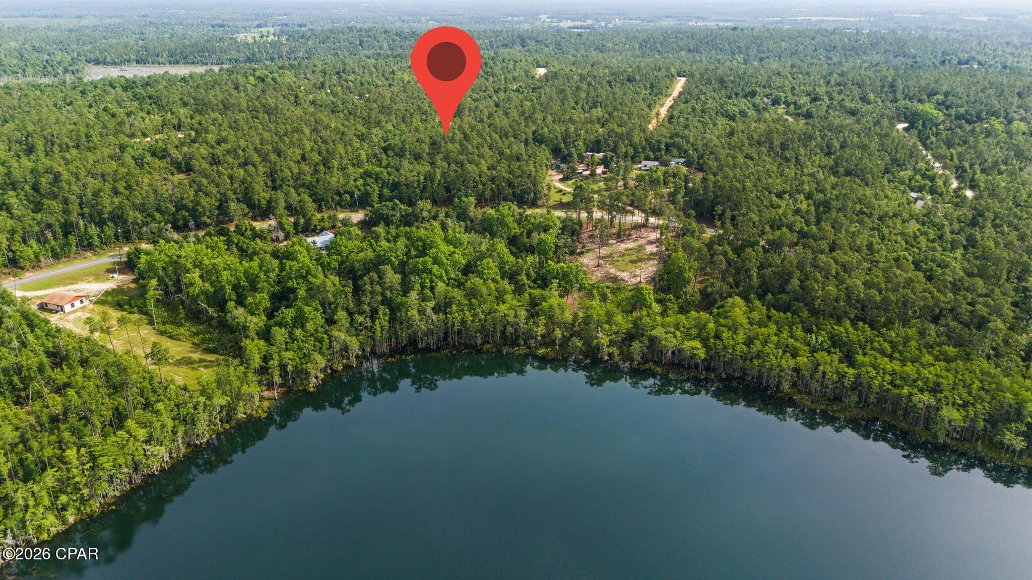 Build your dream home on this beautiful lot of over one acre located directly across the street from scenic McCormick Lake in Compass Lake in the Hills. Offering plenty of space and a desirable location, this property provides the perfect setting for a peaceful retreat or full-time residence surrounded by natural beauty. Property owners have access to a variety of community amenities, including a clubhouse, boat ramp, and beach area on McCormick Lake. Owners who choose to pay the annual dues can also enjoy the community pool and additional amenities at the Compass Lake Clubhouse. Don't miss this opportunity to own a spacious homesite in one of the area's most sought-after recreational communities.