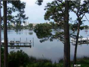 Here's a perfect opportunity to own a waterfront condo in the popular Grand Lagoon Cove complex located right on Grand Lagoon. For boat lovers the complex has a private marina with slips available for short term boat docking (at an additional fee). For those outdoor enthusiasts a swimming pool and tennis court is also available only steps from your front door. You can either enjoy relaxing at the community picnic area or from your balcony; both provide stunning views of the lagoon. Location is everything and at Grand Lagoon Cove you are only minutes from fantastic restaurants, family activities, the beautiful beaches of Panama City Beach and the Gulf of Mexico. Owner financing will be considered.