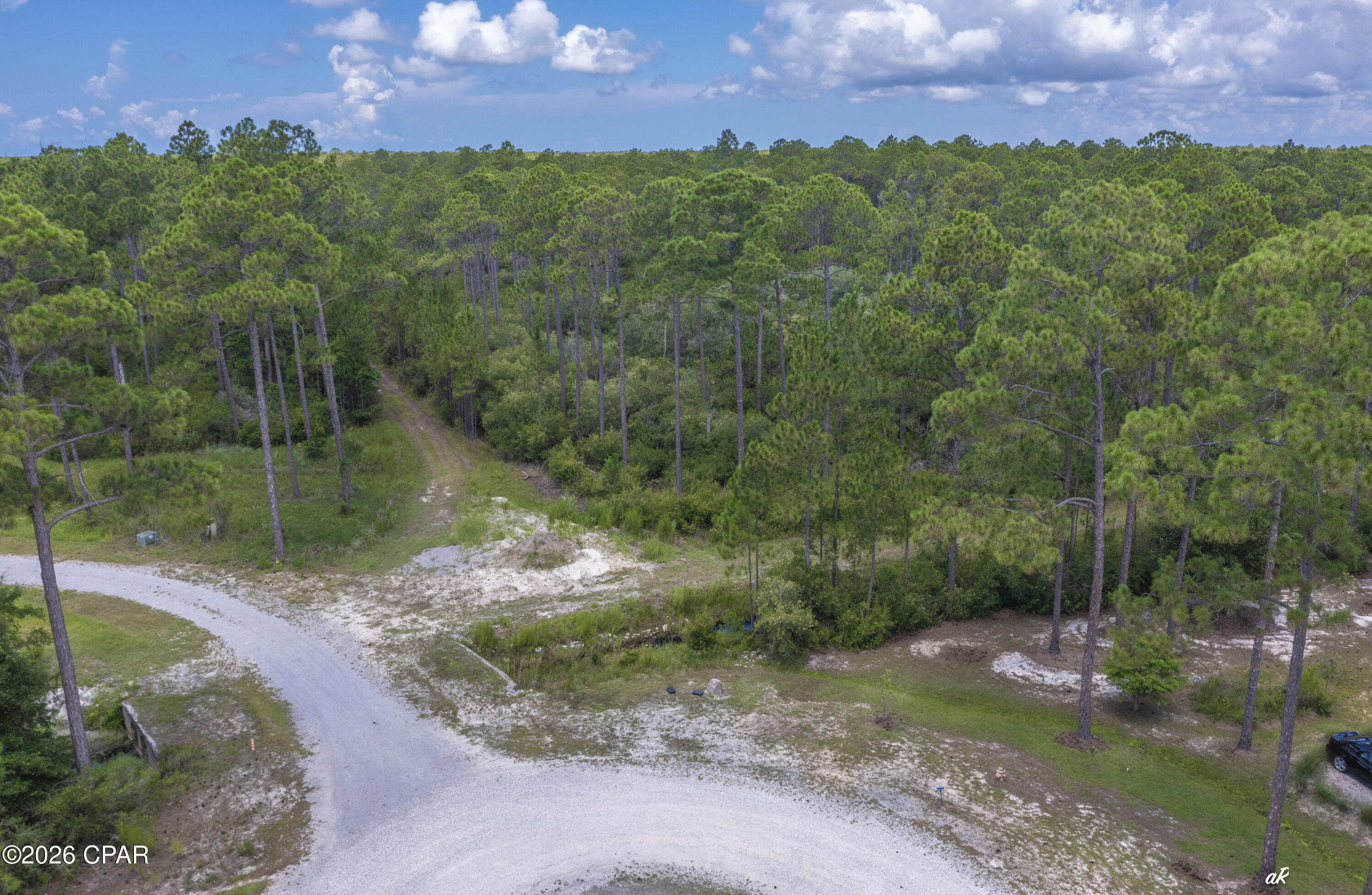Build your dream home in RiverCamps on Crooked Creek, one of Panama City Beach's most desirable gated waterfront communities. Located at 6624 Button Buck Trail, this homesite offers the perfect setting for those seeking privacy, natural beauty, and a true coastal lifestyle. RiverCamps is a unique 1,500-acre community bordered by West Bay, Crooked Creek, and the Intracoastal Waterway, with the majority of the land preserved for conservation. Owners enjoy access to miles of trails and boardwalks, a community boat ramp, day-use boat slips, dry boat storage, a pool, pavilion, playground, and waterfront recreation areas. Whether you are looking to build a primary residence, second home, or coastal retreat, RiverCamps offers the rare combination of seclusion and convenience, just minutes from Northwest Florida Beaches International Airport, Pier Park, area shopping, dining, and the world-famous white sandy beaches of Panama City Beach. Call today to access the community and view this lot.