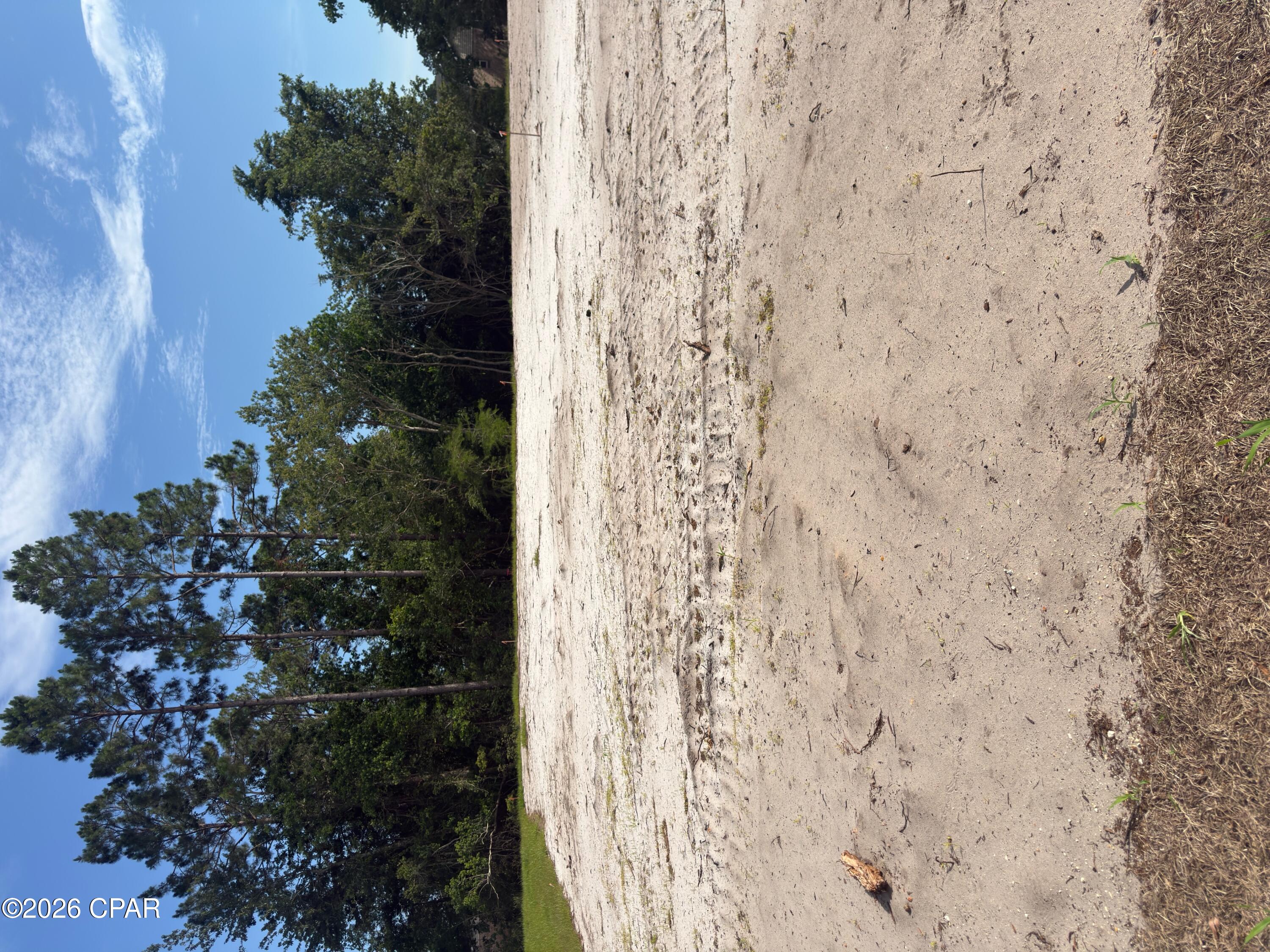 Port St Joe's newest gated and landscaped community with all the possibilities one could ask for. These lots are all X FLOOD ZONE and are eligible for SHORT TERM (DAY, WEEK, OR MONTHLY) or LONG TERM RENTALS. One can legally GOLF CART to Downtown or have easy access to St Joseph Bay. All lots are cleared and ready to build on with no timeframe to for building. Amenities already in place area; Paved street with ribbon curbing, entrance with signage and landscaping, sodded entry on Garrison Ave, water, sewer, under ground electric, elegant street lights for security. Amenities to be installed by the developer are privacy fencing, gated entry and bamboo accents for a border. Subdivision is under the County building and zoning regulations, not The City of Port St Joe.