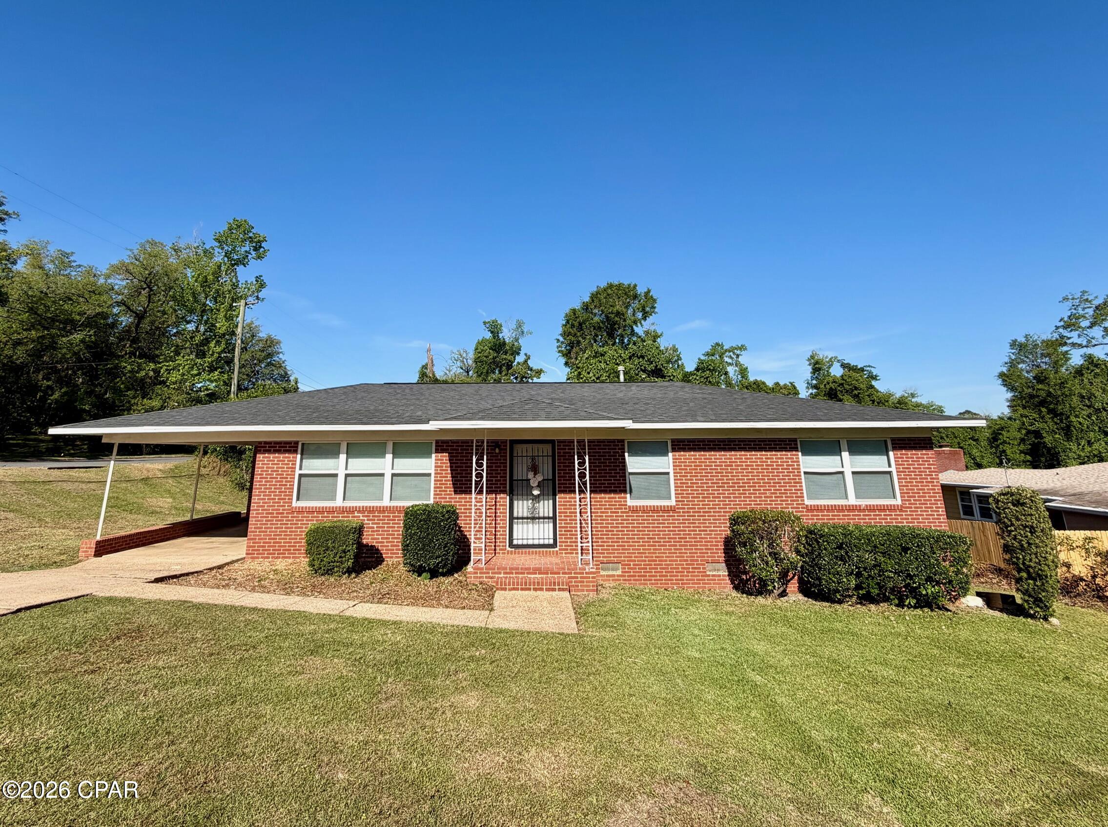 Check out this adorable 3 bedroom, 1.5 bath brick home in Marianna!  The spacious living room features original hardwood floors.  The eat-in kitchen features solid wood cabinets, a breakfast bar and windows overlooking the backyard.  The master bedroom includes a convenient half bath and a walk-in closet.  Step outside to a concrete patio that's perfect for relaxing or entertaining, along with a storage building for your needs.  Situated on a corner lot in a great location, you'll enjoy being close to Jackson Hospital, Chipola College, parks, and shopping.   Major updates include newer windows, new roof in 2019 and a new HVAC system in 2023. Schedule your showing today!