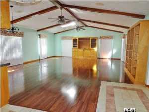 Motivated seller. Reserved beach access. Two homes, double corner lot with a total of 5 bedrooms, 3 full baths, and 2 half baths. This home truly exudes southern charm and sophistication. The main home is a 3 bedroom, 2.5 bath home with a detached 3 car garage. Oversized driveway allows for extra parking (additional space allows for an RV, boat, or extra cars). Dream kitchen with granite counters, custom-built wood cabinets with glass doors. Family room has built-in entertainment center and bookcases. Home is wired with recessed speakers and volume controls in each room for music or television. Wood flooring is located in the family room, hallway, and master bedroom. Skylights are strategically located throughout the home and ample windows brightens every room. Custom vertical blinds