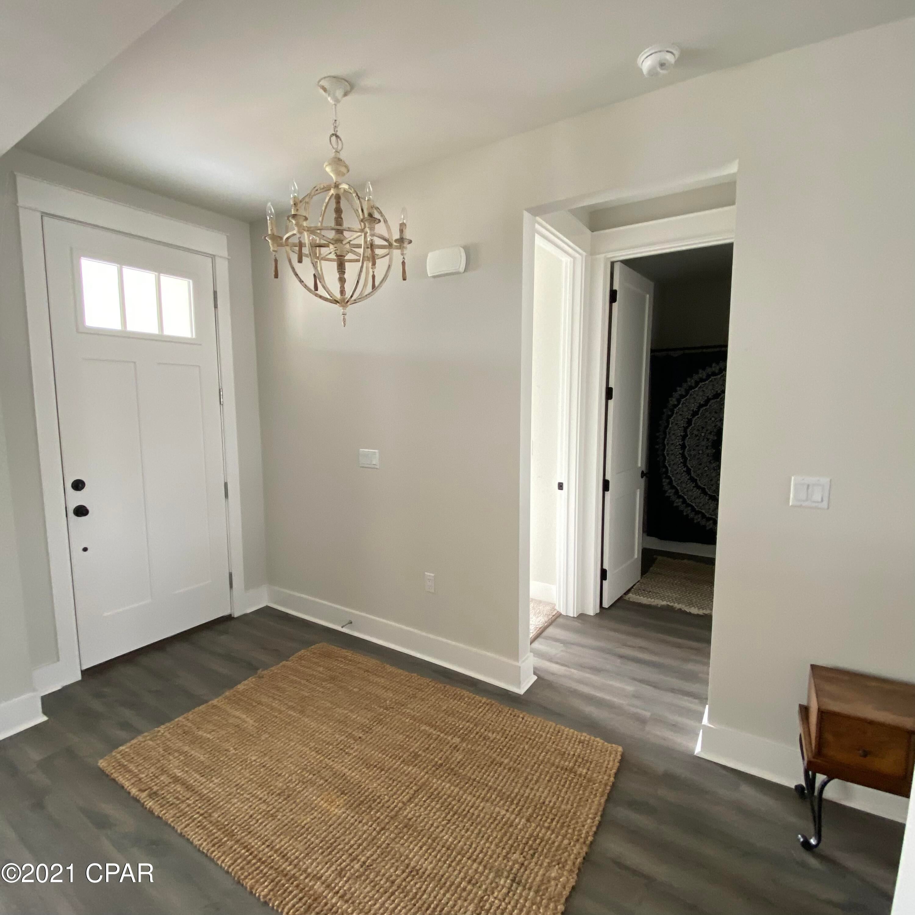 Welcome to Breakfast Point! One of the most popular-fresh communities in Panama City Beach! This Kittiwake Floorplan was built in 2020 to include a spacious 1958S.F. with 4 bedrooms and 3 baths by home builder Southern Coastal Homes. The Breakfast Point subdivision is a Golf Cart friendly and has easy access to the beaches of the Gulf of Mexico. Adjacent to this subdivision is grocery, home improvement, and convenience stores, restaurants, banks, car wash, coffee shops, pharmacies, and Emergency Room. Breakfast Point Academy is within walking distance of this home. This split floorplan coastal-inspired home offers a private grand Foyer entrance, a Great Room open to a chef's kitchen with a gas cooktop, a separate oven with a large center island, custom cabinetry with soft close drawers and stainless steel appliances. Large Master Suite w/ tiled shower, double vanity, and large walk-in closet. The home has a 2 car garage with attic storage space, a covered front porch and a 3-panel glass sliding door that leads you to the covered and screened back porch. The backyard has a privacy fence and is a blank slate ready for your personal landscaping design. Don't miss out on this great home!