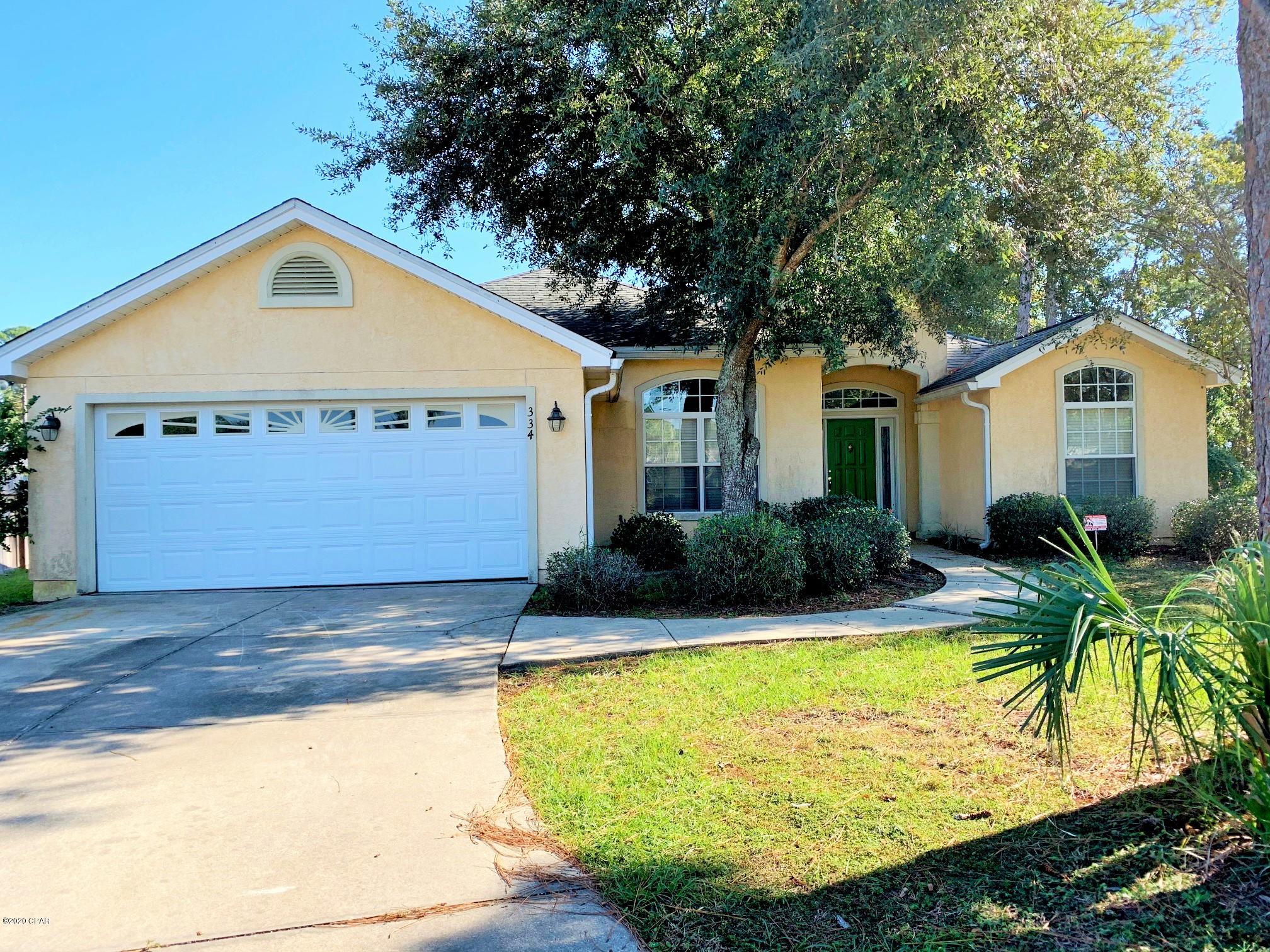 3 bedroom, 2 bath home in Hidden Pines subdivision(East end of Panama City Beach.) Convenient to the Navy Base and beaches. Home has an attached two car garage, split bedroom floor plan and a covered back patio with a fenced back yard. The large master suite features trey ceiling, walk-in closet, adjoining study/office, separate shower and garden tub, and dual vanities. Large  ceramic tiles in the entry way, formal dining area, kitchen, laundry room, and bathrooms. The eat-in kitchen with breakfast bar, dishwasher, microwave, stove/oven and refrigerator with ice maker. This is a no smoking property. Pets are allowed with approval and non-refundable fee; breed restrictions apply.