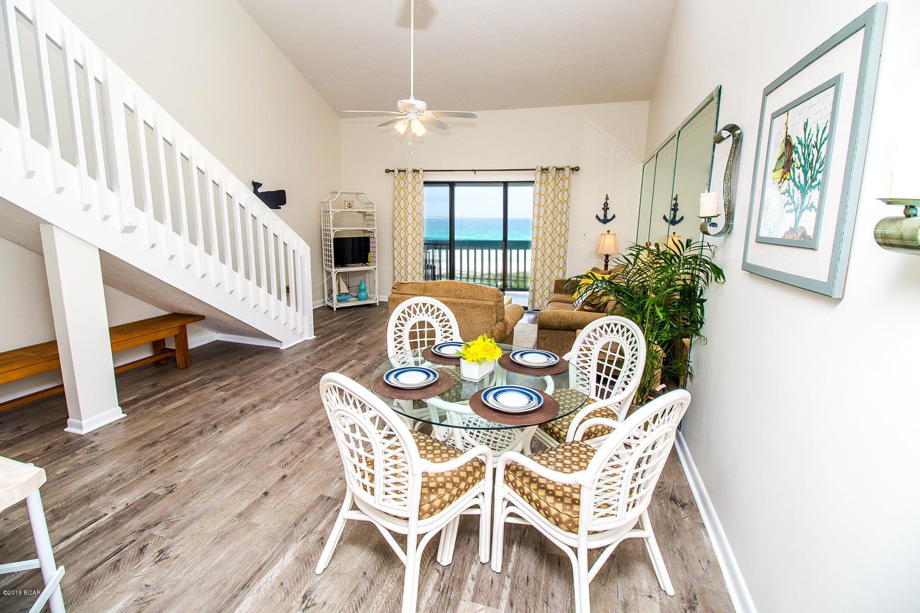 YOUR VERY OWN DEDICATED BEACH!!!**Home comes furnished as seen at showing, including the beachy decor!!!** This 2-story condo with breath-taking and unobstructed views of the gulf comes furnished with dedicated Laguna Beach access! This is a hard unit to come across on today's market! The home has been completely redecorated and has brand new flooring! NEW dishwasher, light fixtures, ceiling fans and range hood.  There is also a community pool and BBQ Pit area. It's a 2BR/2BA unit at the West End of the beach located right next to the Carousel Supermarket making grocery shopping a breeze. This home also has wide open gulf views! **The beach in front of this unit is protected and can never be built on!** Home features two story living area with soaring high ceilings, plus each bedroom has its own bathroom! The home has one bedroom downstairs, and the other is a loft styled bedroom upstairs, making it feel nice and roomy! This is a low rise complex on the West End of Panama City Beach, meaning no waiting for an elevator! All interior furniture conveys! Age, Square Footage, and room sizes are approx, if important please verify.