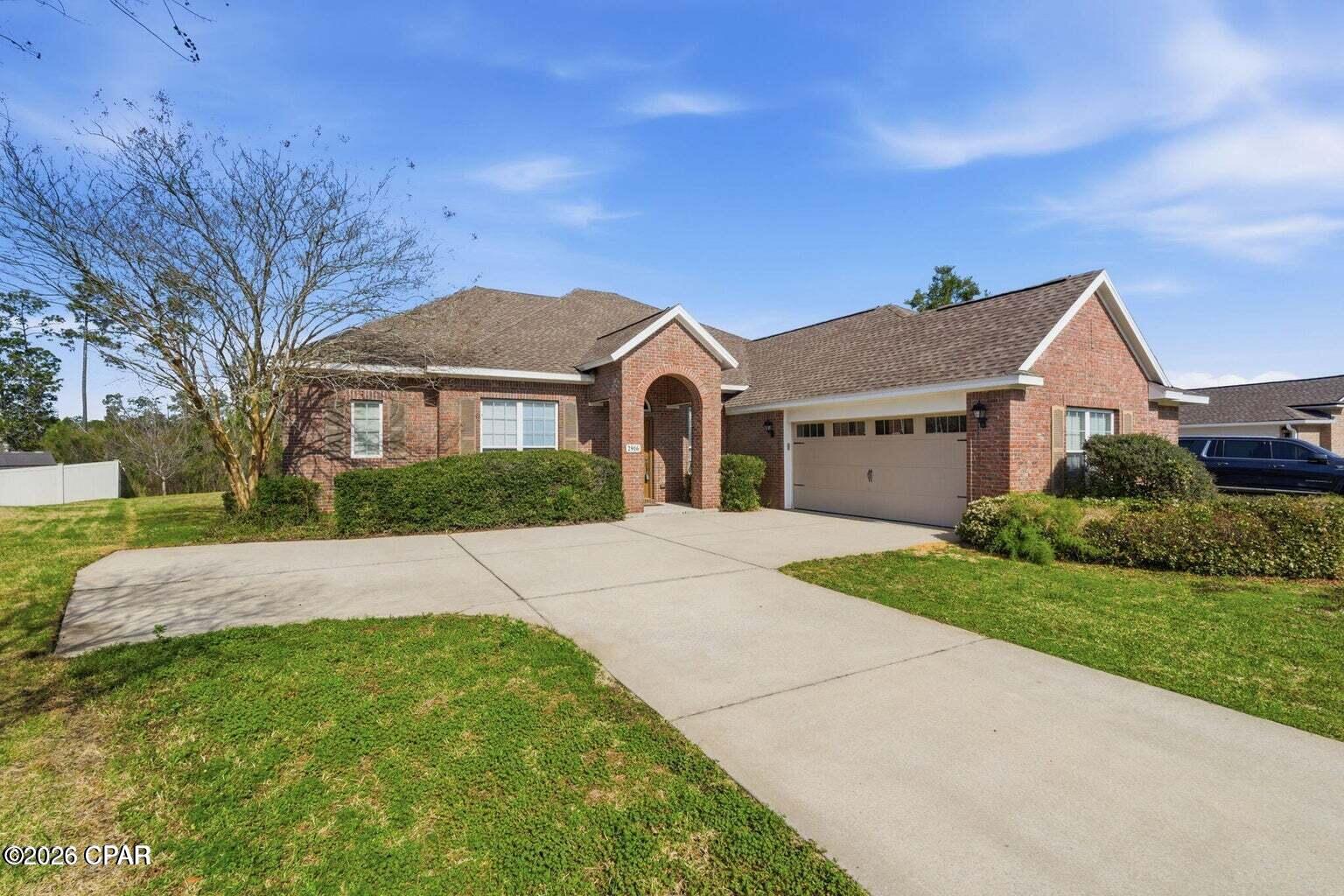 Beautiful, Spacious Hawks Landing Home | Approx. 3,605 Sq. Ft. with Effectively 6 Bedrooms | Lowest Price Per Sq/ft Rental on the Market | Private Wooded Setting | Sought After Schools Near By |

You will not find another home with this much space for this price!

Space, privacy, and an exceptional Hawks Landing location come together in this spacious Panama City home offering approximately 3,605 square feet of flexible living space on approximately 0.39 acres.

Located in the established and highly sought-after Hawks Landing community, the home is especially convenient to Bay Haven Charter Academy, making it an excellent option for households looking to live close to the school. Shopping, dining, grocery stores, A. Crawford Mosley High School, and everyday services are also nearby, while the beaches of the Gulf Coast are approximately 13 miles away.

The property enjoys a particularly private setting within the neighborhood. The front of the home overlooks a shared neighborhood green space, in an offset  loop away from the main traffic, while the backyard backs to a wooded natural buffer with no homes directly behind the property, creating a peaceful setting that can be difficult to find in such a convenient Panama City location.
Inside, 10-foot ceilings on the main level, genuine hardwood flooring, crown molding, arched openings, decorative columns, and a gas fireplace with built-in shelving give the home a spacious and inviting feel.

The kitchen features granite countertops, stainless steel appliances, abundant cabinetry, recessed lighting, and a raised breakfast bar overlooking the main living area, providing plenty of room for both everyday living and entertaining.
The main level offers an oversized primary suite along with three additional bedrooms and a fifth bedroom/flex space currently configured as an office. A dedicated dining room and additional flex room provide even more versatility for a home office, playroom, sitting room, or other use.

The spacious primary suite includes dual granite vanities, a corner jetted tub, and a separate glass-enclosed shower.

Upstairs, a large bonus room with access to its own full bathroom creates an entirely separate and flexible living area. It could serve as a media room, game room, recreation space, or private guest suite. With this room including it's own full bath and walk in closet, it could be used as a second primary bedroom, if desired.

A covered rear porch extends the living space outdoors and overlooks the private backyard and wooded buffer. Additional features include an irrigation system supplied by reclaimed water and utilities provided by the City of Lynn Haven.
With approximately 3,605 square feet, a highly flexible floor plan, exceptional privacy, and a location close to Bay Haven Charter Academy, this Hawks Landing home offers a combination of space and convenience that is difficult to find.

Schedule your showing and see everything this spacious Hawks Landing home has to offer.