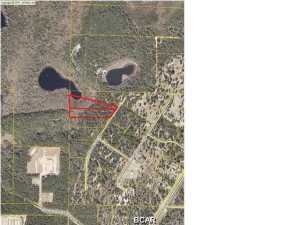 9 Beautiful wooded waterfront acres! Located just south of Sunny Hills in Washington County. This property is 2 adjacent parcels on Buck Lake. Lots of old growth trees throughout the property. You don't have to worry about lots of traffic here because it is located near the end of the cul-de-sac. Plenty of privacy yet only 30 minutes to Panama City! The mobile home is in need of repair but was lived in until a few months ago. The well and septic are already in place and work perfectly.