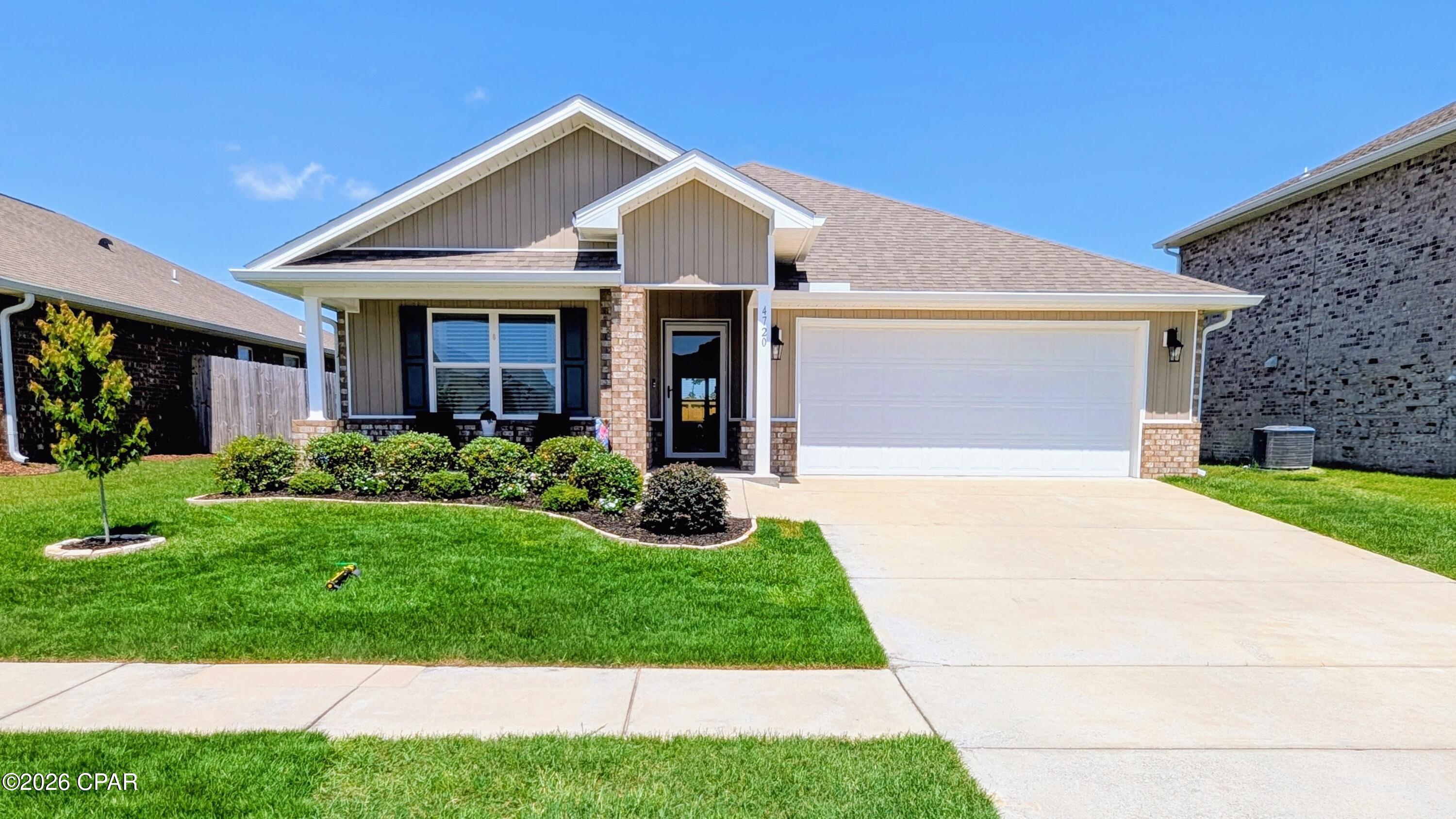 Move right into this beautifully maintained 4-bedroom, 2-bath home offering 1,827 square feet of thoughtfully designed living space in the highly desirable Titus Park community. Unlike many new construction homes, this property is loaded with premium upgrades and move-in-ready conveniences already in place.

The open-concept floor plan is perfect for everyday living and entertaining, featuring a spacious kitchen with a large island, under-cabinet lighting, dimmable island lighting, pull-out cabinet drawers, abundant pantry shelving, and a refrigerator that conveys. The kitchen flows seamlessly into the dining and living areas, creating a bright and inviting gathering space.

The private owner's suite offers a relaxing retreat with double vanities, an oversized soaking tub, a separate walk-in shower, medicine cabinet, robe hooks, and a generous walk-in closet enhanced with custom shelving for exceptional storage.

The well-equipped laundry room includes upper cabinets, a hanging rod with decorative shelf, and the washer and dryer are included. 

Throughout the home you'll find window blinds, curtain rods, remote-controlled ceiling fans, and Smart Home technology featuring keyless entry, smart thermostat, lighting controls, garage door access, security camera, smart locks, sensors, and an integrated alarm/control panel.

Outside, enjoy the durability and curb appeal of a four-sided brick exterior, covered front porch, covered rear patio, gutters, professionally landscaped yard, and a beautiful stained board-on-board privacy fence with heavy-duty gates on both sides. The painted two-car garage includes a bright shop light, while the extended driveway provides parking for multiple vehicles.

Located just outside Lynn Haven, Titus Park offers exceptional community amenities including sidewalks, expansive green spaces, a resort-style pool with pavilion and BBQ areas, lounge seating, and a dog park. The home is conveniently located near North Bay Haven Charter Academy, Highway 231, the new Publix Shopping Center with Starbucks, and Deer Point Lake.

Meticulously cared for and exceptionally clean, this home combines quality upgrades, modern convenience, and an unbeatable location. Better than new and truly move-in ready, it's ready to welcome its next owner.