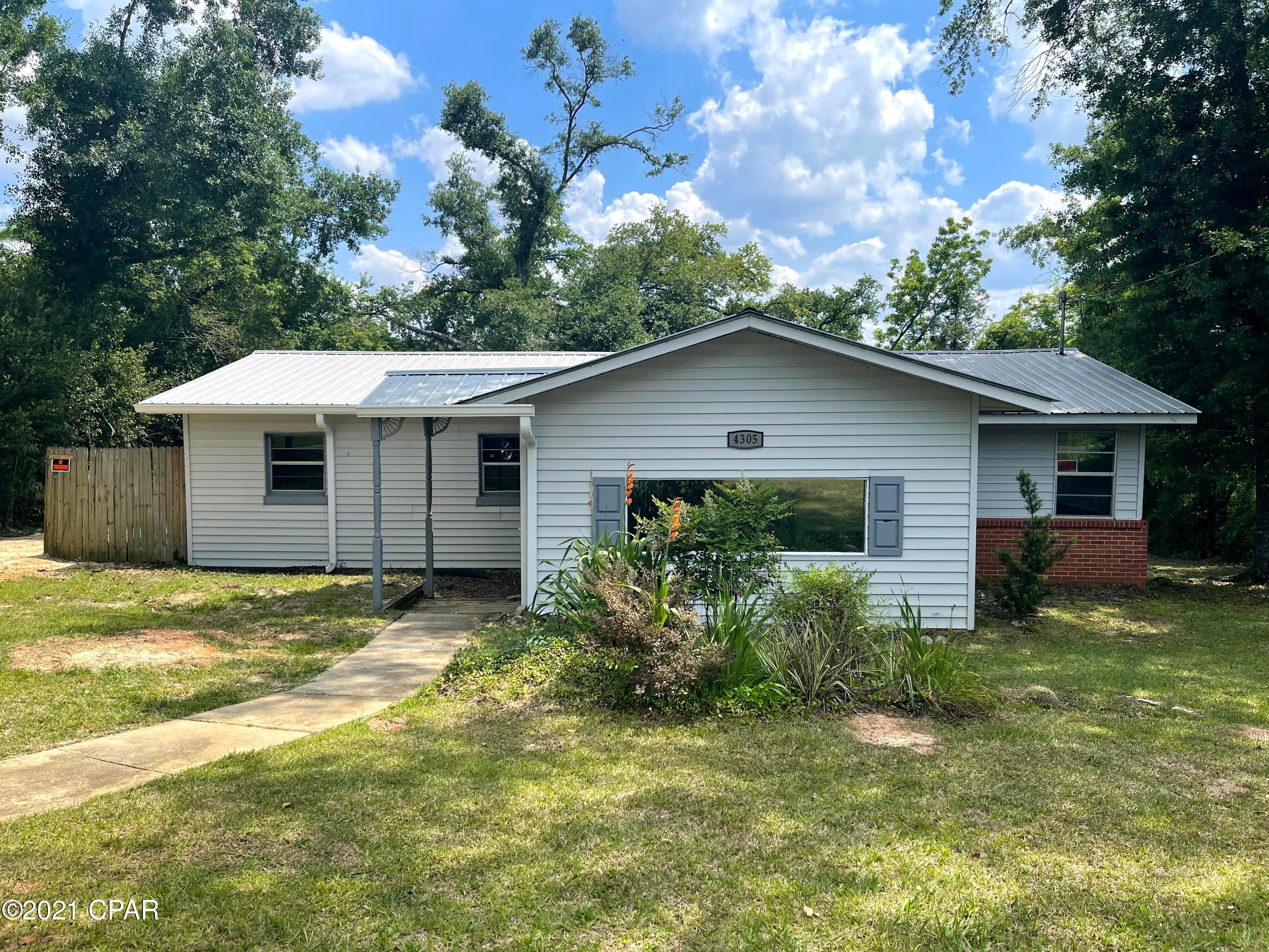 CURRENTLY UNDER CONTRACT; SELLER IS ACCEPTING BACK UP OFFERS. Three bedroom two bathroom home with large screened in back porch and bonus room to be used as storage room or extra living space. This home features white cabinets, formica counter tops and tile backsplash in the kitchen and the master bedroom has en suite bathroom. The living room and kitchen has wood look vinyl floors and all of the bedrooms are carpeted. This home is located in close proximity to downtown Marianna, I-10 and Jackson Hospital.