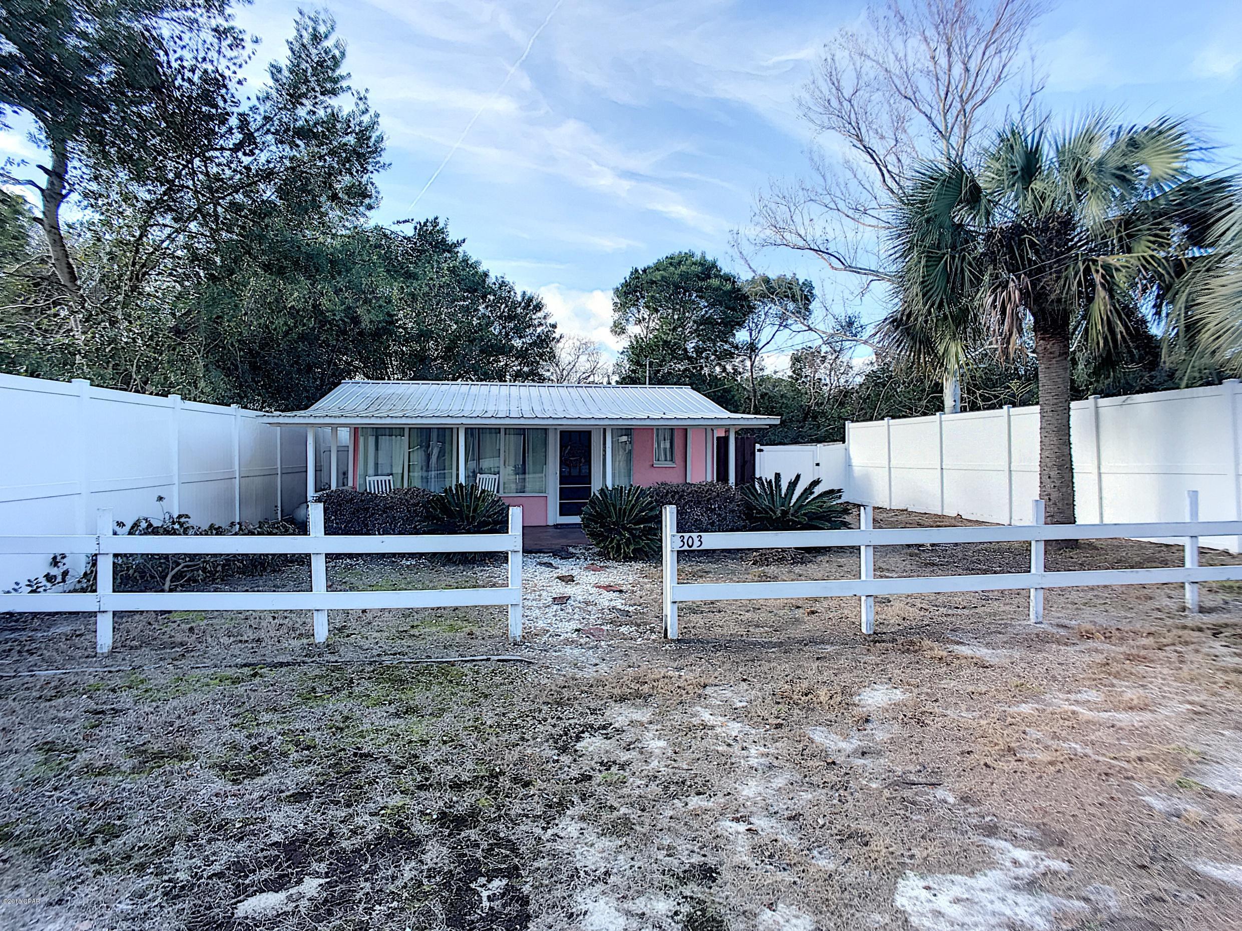 Rare opportunity to own a beach cottage on a large lot in iconic Laguna Beach for under $200K! There is a reason why Laguna Beach is so sought after, and once you experience the ''old beach town'' charm you will know why! This 1960's beach house has a front porch made for relaxing and enjoying the gulf breeze, massive front yard, fenced backyard, outside shower with privacy fencing, and is only 2 blocks to the sand!  Plenty of room to park your boat, golf cart, even an RV while you're vacationing at the World's Most Beautiful Beaches!