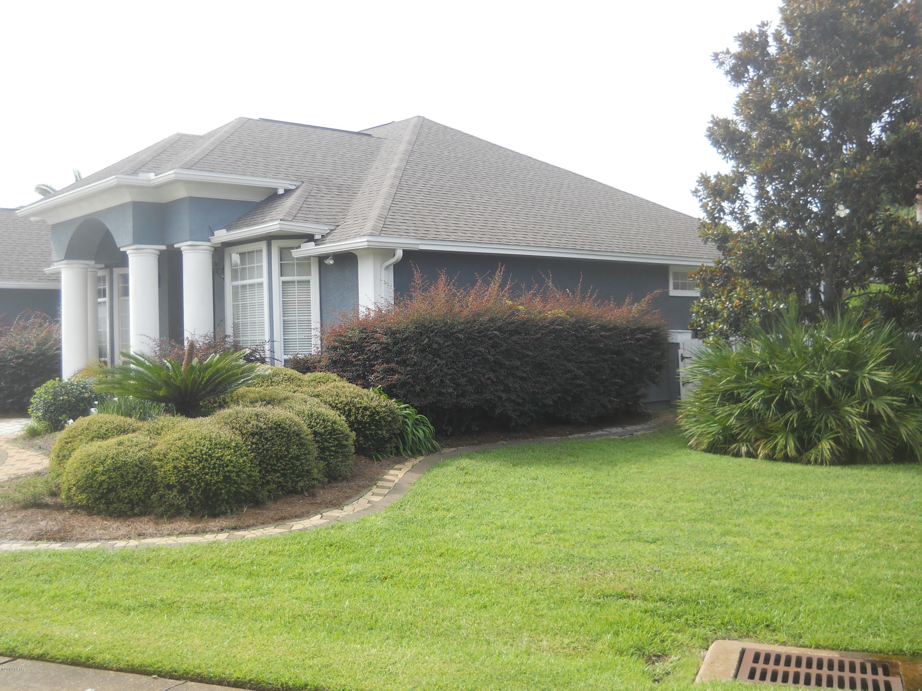 Beautiful house located in central area of Panama City Beach. Home is located in a GATED WATERFRONT COMMUNITY with a PRIVATE MARINA and BOAT RAMP.  Home features a fireplace, crown molding throughout, a SCREENED-IN POOL, beautiful wood flooring, exquisite lighting, and granite counter tops.  Home also features electronic sound system with speakers built-in throughout the interior and exterior of the home. Walk out on the back door to your very own screened-in heated pool with large patio. This home is a must see and VERY WELL taken care of. All information is approximate and taken from Public Records. If important to buyer, please verif