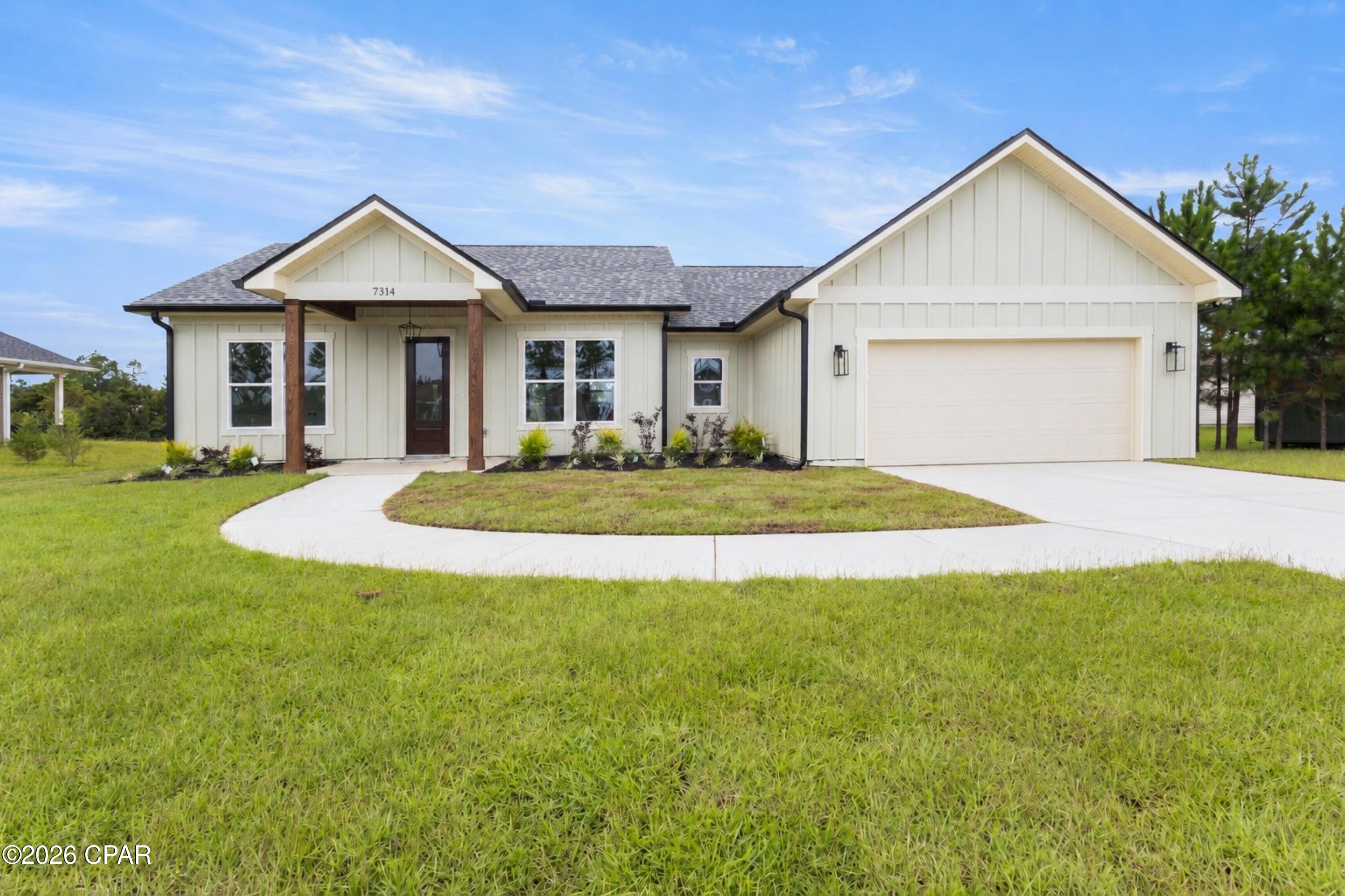 Welcome to this stunning custom built 3 bedroom, 2.5 bath home offering 1,696 square feet of thoughtfully designed living space with peaceful pond views. From the moment you arrive, the modern farmhouse exterior, board and batten siding, warm wood accents, and inviting entry set this home apart.

Inside, you'll find an open concept layout filled with natural light and upscale finishes throughout. The beautiful kitchen features quartz countertops, custom cabinetry, a large center island, stylish pendant lighting, tile backsplash, and designer hardware perfect for both everyday living and entertaining.

One of the home's standout features is the custom walk-in pantry, complete with built-in shelving, cabinetry, countertop workspace, and plenty of storage.

The primary suite continues the custom feel with a spa inspired bathroom featuring a double vanity, freestanding soaking tub, oversized tiled walk-in shower, frameless glass enclosure, and modern black fixtures.

With 3 bedrooms, 2.5 baths, a two car garage, custom finishes, and a pond front setting, 7314 Rachel Way combines modern style, functionality, and peaceful waterfront living in one beautiful package. Brand new construction without the cookie cutter feel this one needs to be seen in person.