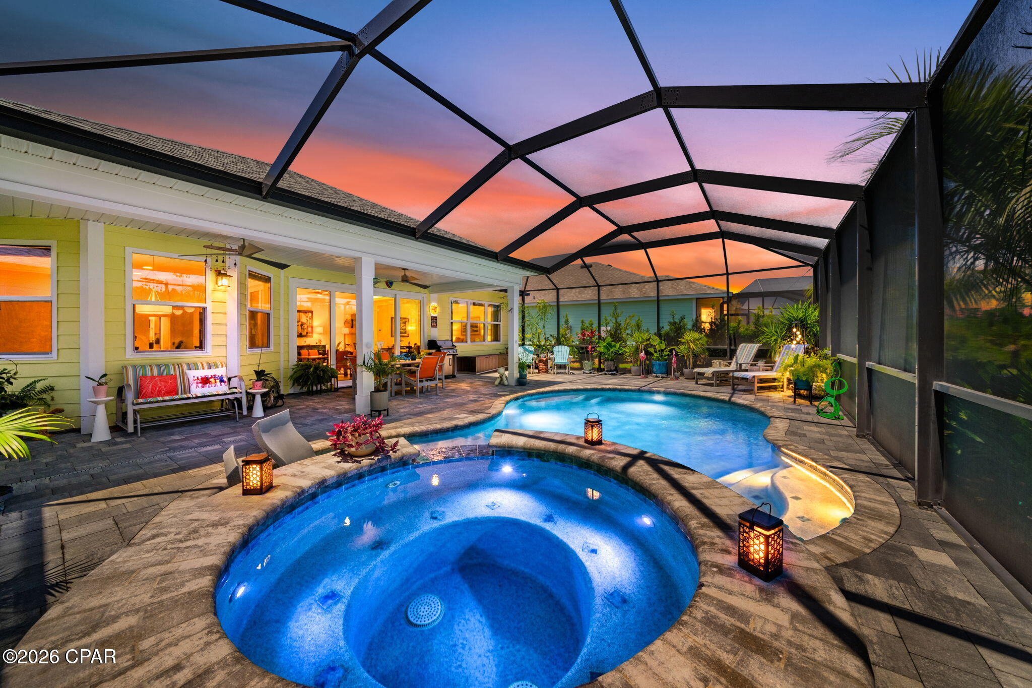 CURRENTLY UNDER CONTRACT, SELLER WILL CONSIDER BACKUP OFFERS.

Welcome to your own Palm Springs-inspired oasis in the heart of Latitude Margaritaville Watersound! This sophisticated luxury home (Coconut Floorplan) blends mid-century modern vibes with elevated designer finishes and resort-style outdoor living in one of the Emerald Coast's premier 55+ active adult communities.

Step inside to an open-concept floorplan featuring dramatic vaulted ceilings and a stunning great room that flows seamlessly to the outdoor tropical retreat. The designer kitchen is truly a showpiece with custom cabinetry in a sophisticated designer color palette, granite countertops, dramatic full-height granite backsplash, custom hardware, range hood, gas cooktop, Samsung Bespoke designer refrigerator, cabinet pull-outs, and upscale designer lighting throughout.

The spacious primary suite offers a tray ceiling and spa-inspired bath featuring an oversized rain shower, frameless glass enclosure, upgraded tile selections, and a spacious walk-in closet with custom Elfa shelving. The flex room/den showcases vintage-inspired wallpaper and designer paint, perfect for an office, media room, or overflow guests. A secondary bedroom is adjacent to a beautifully upgraded full bath with walk-in shower option, frameless enclosure, and designer tile finishes.

Outdoor living is exceptional with a heated saltwater pool and spa surrounded by lush, recently upgraded tropical landscaping creating a true private oasis. Relax while overlooking a protected wildlife area where birds and nature can be enjoyed year-round.

Additional upgrades include epoxy garage flooring, pull-down attic stairs, painted garage, utility sink, added attic flooring and insulation, water filtration system, impact glass-rated front door, upgraded garage door, whole-house gutters, Generac generator, approximately $15K in custom landscaping, custom draperies, 8-foot interior doors, lanai gas line for grilling, and Elfa shelving in the laundry room. Home includes a 10-year structural warranty from original build date for added peace of mind.

Latitude Margaritaville Watersound offers an unparalleled resort lifestyle with world-class amenities including a resort-style pool, indoor lap pool, fitness center, pickleball and tennis courts, restaurant, bar, live entertainment, walking and golf cart trails, dog parks, hobby clubs, and a vibrant social calendar. Conveniently located approximately 7 miles from the sugar-white sands of the Emerald Coast with future shopping, dining, Publix, marina access, and a new state-of-the-art hospital approx. 5 miles under-construction. Experience the Latitude Margaritaville lifestyle where every day feels like a vacation!

Combined with world-class amenities, vibrant social activities, golf cart living, and close proximity to the beach, Latitude Margaritaville Watersound offers one of the most desirable active adult lifestyles along the Emerald Coast.