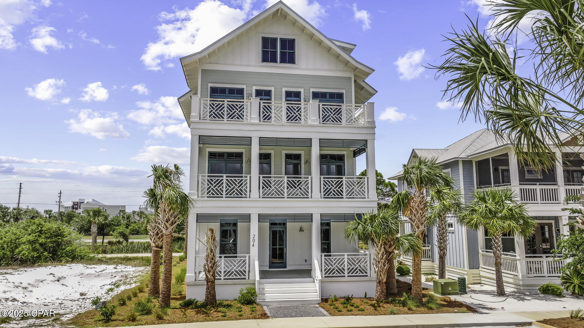 COASTAL LUXURY IN OVATION. This impeccably crafted 5-bedroom, 3.5-bath home is a showcase of architectural elegance, thoughtful design, and effortless beachside charm. From the moment you arrive, you'll be captivated by its stately presence and inviting wraparound porches that beckon you to unwind while soaking in panoramic views of the sparkling St. Joe Bay. Step inside to discover an open-concept layout filled with natural light, refined finishes, and a perfect blend of modern sophistication and relaxed coastal style. The main living area is ideal for entertaining, with seamless flow between the gourmet kitchen, dining, and spacious living room--all opening to expansive balconies that make every sunrise and sunset feel like a private show. Every detail is meticulously curated, from the sleek flooring and upscale fixtures to the coastal hues that mirror the beauty of the surrounding waters. The oversized garage offers room for multiple vehicles, a golf cart, and all your beach and bay gear. Whether launching a kayak from the private bayfront beach or enjoying deeded access to the Gulf's sugar-white sands just across the street, this home offers the best of both shores. Located within Ovation, one of Cape San Blas' most exclusive gated communities, you'll enjoy world-class amenities including bayfront and Gulf-side pools, a state-of-the-art fitness center, tennis courts, a fire pit lounge, fishing piers, and direct boardwalk access to pet-friendly beaches. Two bayside docks cater to boating and paddle enthusiasts, while lush landscaping and winding trails provide a tranquil backdrop for your everyday escape. Perfect as a full-time residence, luxurious vacation getaway, or high-end rental investment, this home delivers a lifestyle few can match. Take in all that nature has to offer just a short drive to nearby St Joseph State Park, rated number one in America, twice! Call for your private tour & LIVE THE BEACH LIFE!