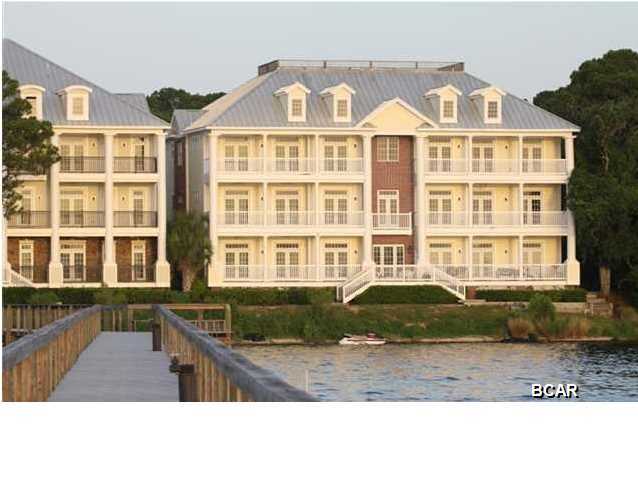 BAYFRONT CONDO!! Imagine the view!!You must visit this AMAZING gated property, right on St. Andrews Bay, with a marina, storage facility, pool & owners club. The view is outstanding looking over the Bay to downtown St. Andrews. This villa has it all! Hardwood floors, granite counter tops, sub zero fridge, extra ice maker, wine cooler, Bosch DW, Viking 6 burner gas stove and more.