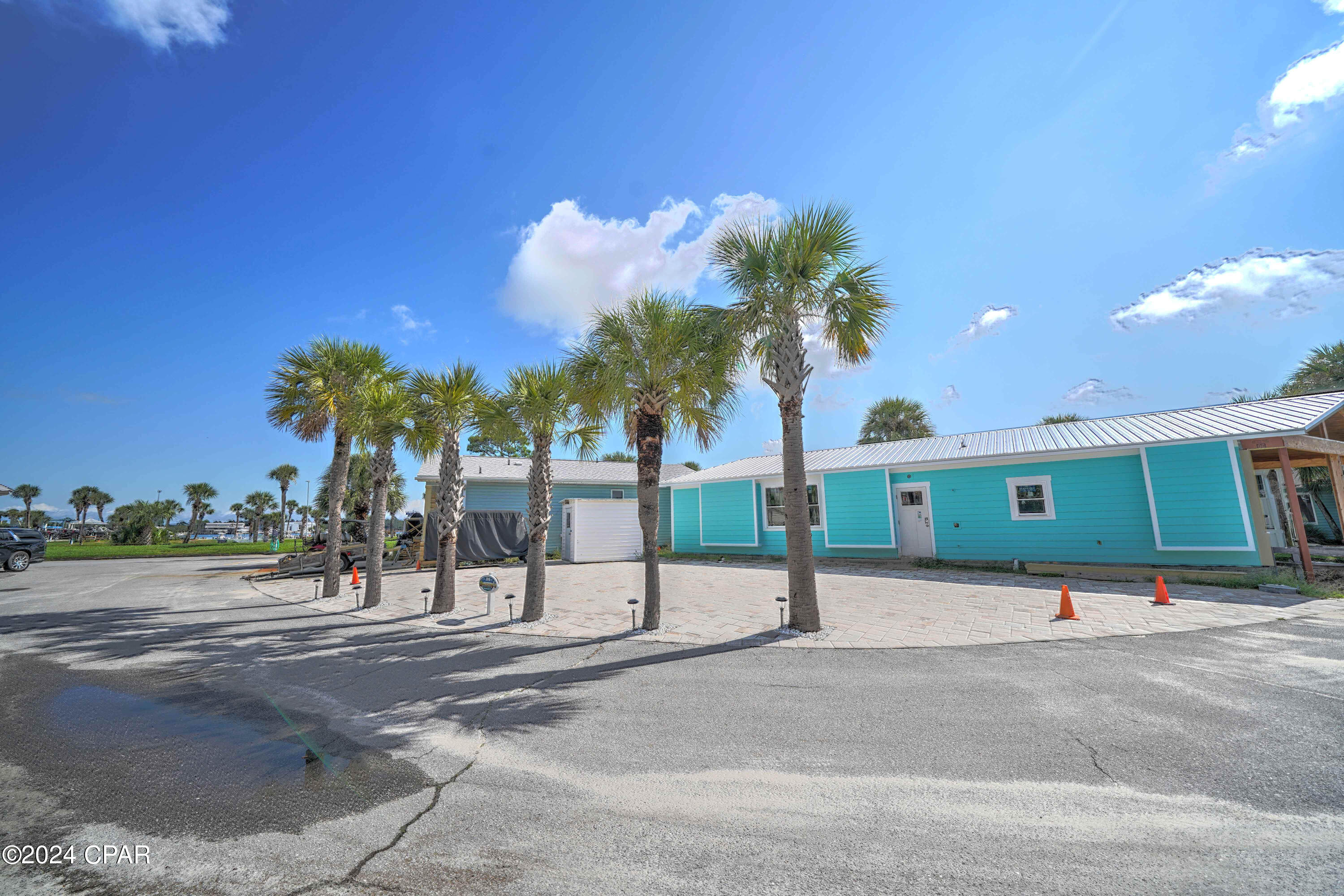 Great opportunity to own in beautiful Venture Out. This stunning corner lot is perfect for building your dream home or bring your RV! The location is amazing within the resort... close proximity to pool, boat launch, fishing pier and more! Venture Out is a golf cart community that has exploded with popularity recently... With 300' on the beautiful pristine beaches of the Gulf of Mexico and 1,000' on the Grand Lagoon. Venture Out has something for everyone. With 2 pools, fishing pier, boat ramp, mini golf, children's playground and much more!