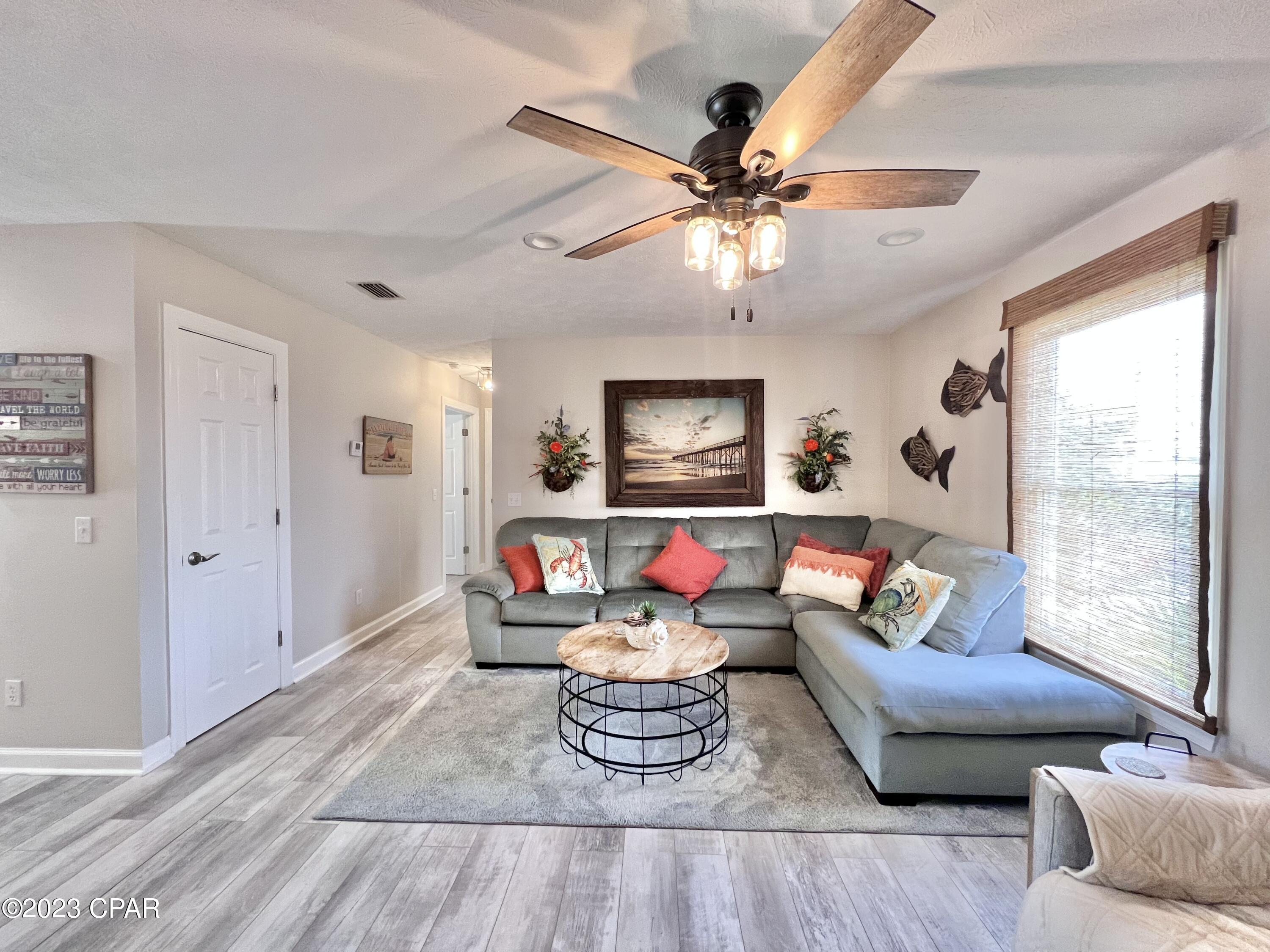 Hidden Gem in the Heart of PCB! 
This lovely condo has 1 bedroom upstairs with a jetted tub and separate shower along with a spacious kitchen and roomy living space while the downstairs boasts a large Efficiency that is equipped with a queen size Murphy bed, full bath with walk in shower, bunks and a kitchenette! This unit is unique in so many ways! Enjoy this space as your private home with separate living space for family and friends to visit or rent it out. This unit could possibly be two separate rentals was well. The kitchen has granite countertops and stainless steel appliances. Laundry is conveniently located beside the kitchen as well as a front porch where you can relax and enjoy the day. Full size private garage space for your automobile, motorcycles, beach toys, boat, etc.. Enjoy Outdoor living space downstairs off the efficiency with a grilling area and Astroturf. Community pool steps away. Endless opportunities and close to Everything!  Currently a vacation rental. Won't last long, come see it today!