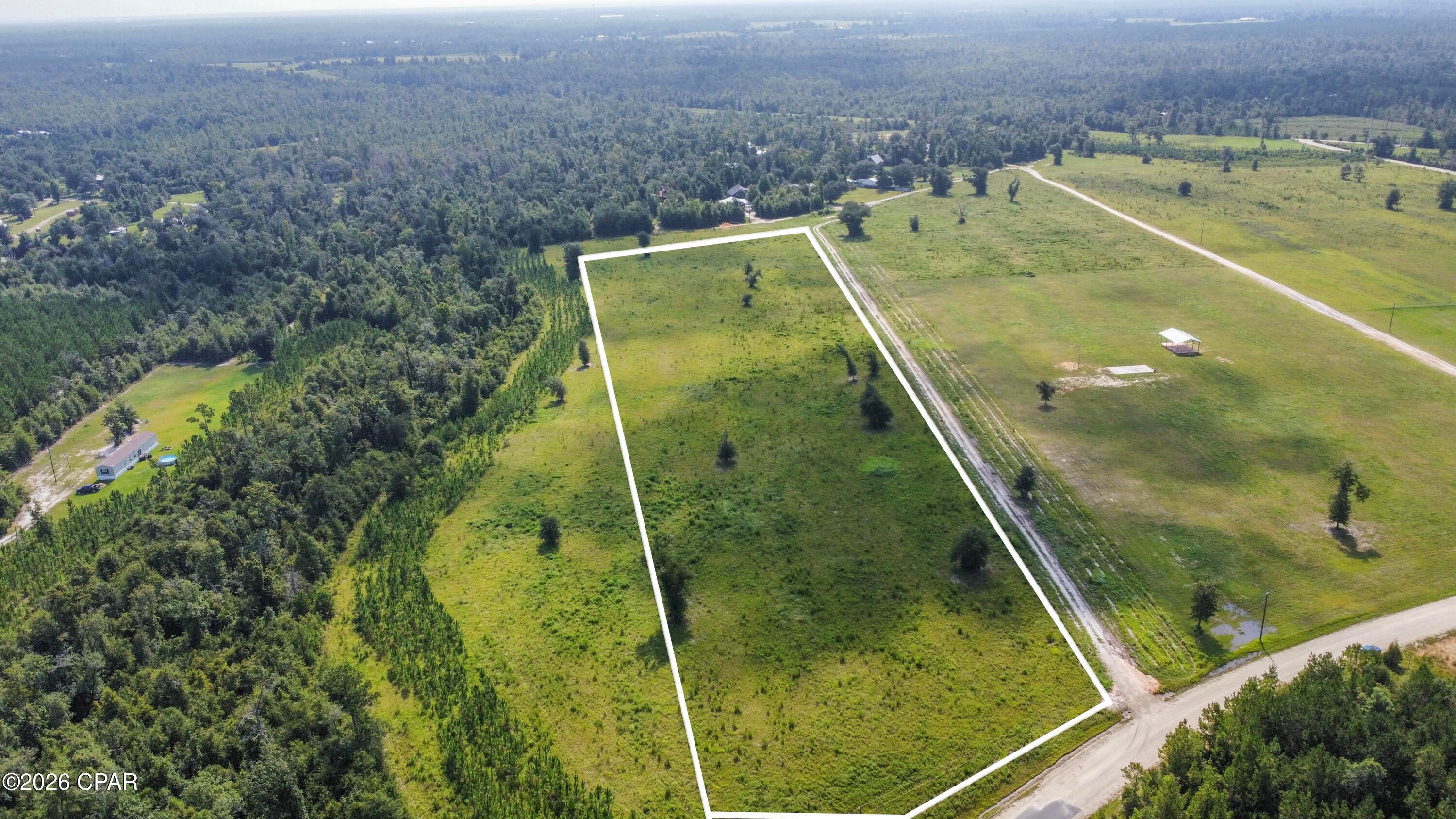 Discover the possibilities on Lot 9 in Chipola Acres, offering 8.81 acres of mostly level, cleared land in a peaceful country setting. With approximately 1,365 feet of depth from the entrance, the property provides plenty of room to position a home well back from Bailey Cemetery Road.

This deed-restricted property does not permit mobile homes within 800 feet of the road. However, approval for a new double-wide or triple-wide beyond the 800-foot boundary may be considered, provided the proposed change does not negatively affect neighboring properties or property values.

Bring the horses, establish a pasture, grow fruit trees, plant a garden, or raise cattle--the soil is well suited for a variety of agricultural uses. Archery hunting is permitted, and the area supports an active population of deer and other wildlife.

Chipola Acres is a newly approved minor subdivision located approximately 200 feet from the beautiful Chipola River. Nearby public parks and boat ramps provide convenient opportunities for boating, canoeing, kayaking, swimming, and fishing, including excellent bass and bream fishing. Enjoy open space, abundant wildlife, and the quiet serenity of country living.

Buyer should independently verify deed restrictions, permitted uses, mobile-home approval requirements, hunting regulations, measurements, and all information deemed important.