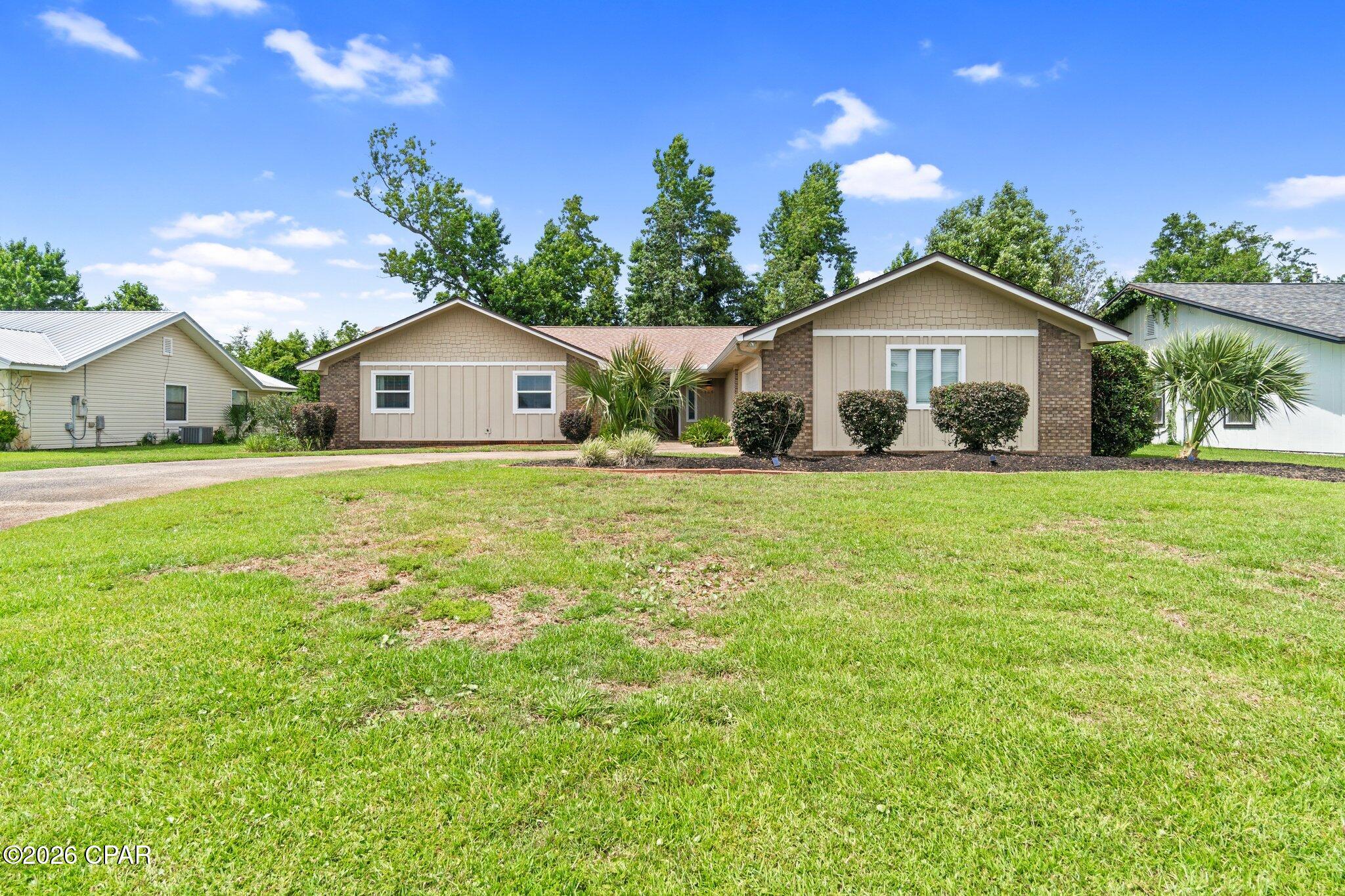Move-in ready.  This Derby Woods home puts you minutes from schools, shopping, and Tyndall AFB--plus parks and trails nearby, and no lender-required flood insurance.

Inside, vaulted ceilings and new vinyl plank flooring set the tone, anchored by a whitewashed brick fireplace (recently serviced). Fresh paint, new blinds, and new sliding glass doors open up the living space. The kitchen shines with quartz counters, new backsplash, stainless appliances, and room for a floating island, plus a walk-in pantry and office nook nearby.

New carpet and ceiling fans fill the bedrooms, while the primary suite offers a glass-tile walk-in shower, double quartz vanity, and a spacious walk-in closet with built-in shelving.

Out back, a large vaulted covered patio overlooks a landscaped yard with space for a pool, gardening, or entertaining.

Extras: oversized climate-controlled garage with sealed floor and wash room, new roof, new windows, new garage door/motor, and recessed lighting throughout.