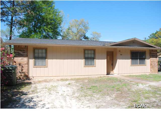 Need an affordable three bedroom house with two full baths, a roof replaced three years ago, recently painted inside and out and in a super convenient location? Look no further. Centrally located in Lynn Haven, this home has much to offer. The family room is open and bright. The large eat-in kitchen has a breakfast bar and pantry and opens to the back yard and covered patio. The washer/dryer hookup is inside as well. The back yard is fully fenced with covered RV/boat parking with a side gate for easy access. There is an additional side gate for extra parking access as well. In addition there is a large yard building and additional exterior storage attached to the house. Recently painted inside and out (ceilings too!) and tiled throughout for easy maintenance. Call your Realtor today
