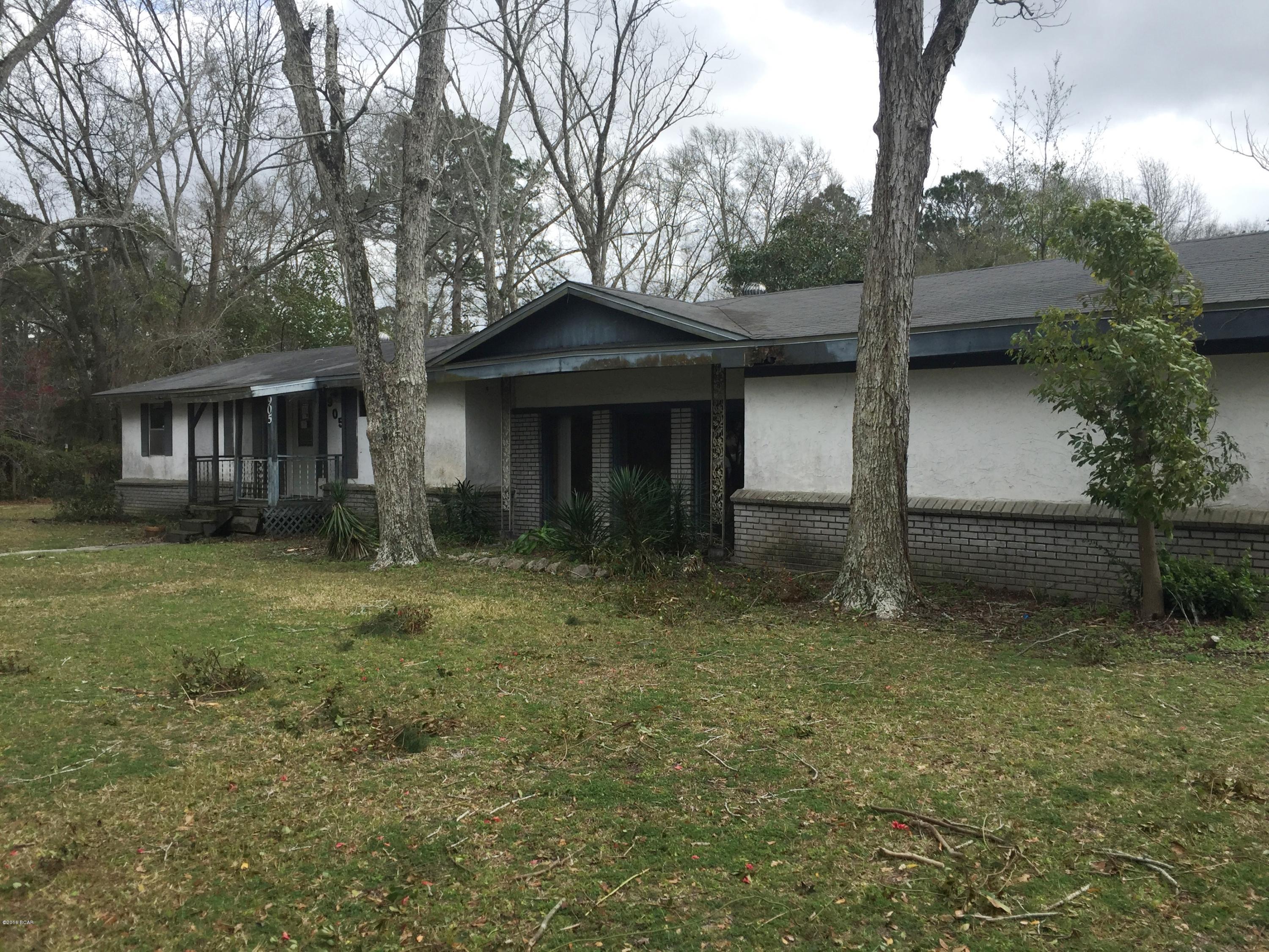 Sprawling ranch style home in Lynn Haven. Beautiful huge corner lot with mature trees mostly fenced in. This 3 bedroom, 2 bath home has a living room plus a large family room with a brick fireplace and an eat in kitchen. It also has a 2 car garage and a shed.