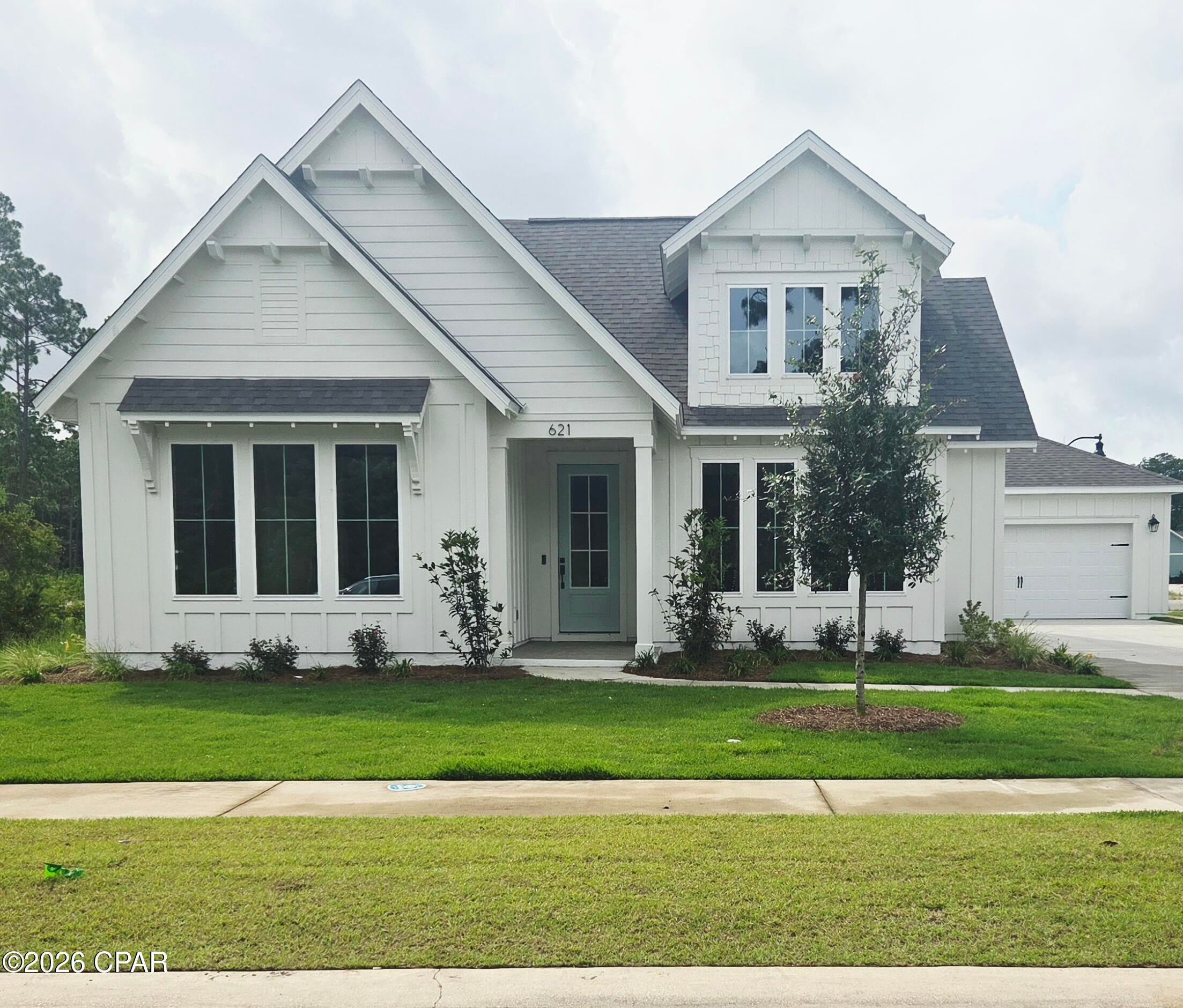 CURRENTLY UNDER CONTRACT, CONTINGENT ON HOME TO SELL. SELLER WILL ACCEPT A NEW CONTRACT SUBJECT TO ORIGINAL BUYER'S 48-HR KICK OUT CLAUSE. Builder incentives of $32,500 with a preferred lender! WOW! This stunning Sheffield plan by Harris Doyle Homes is move-in ready in Breakfast Point East. This spacious home has 3 bedrooms with 2.5 baths (optional powder bath added) and is situated on a corner home site with conservation woods on one side, pond view in the front of the home and across from the community mailboxes. This  plan offers plenty of comfortable indoor and outdoor living space with a large Great Room and kitchen extending out to a covered lanai. The impressive round foyer will wow your guests. The primary suite features a large tile-to-ceiling shower and walk-in closet. Breakfast Point East is a walkable and golf-cart friendly community near the Gulf!