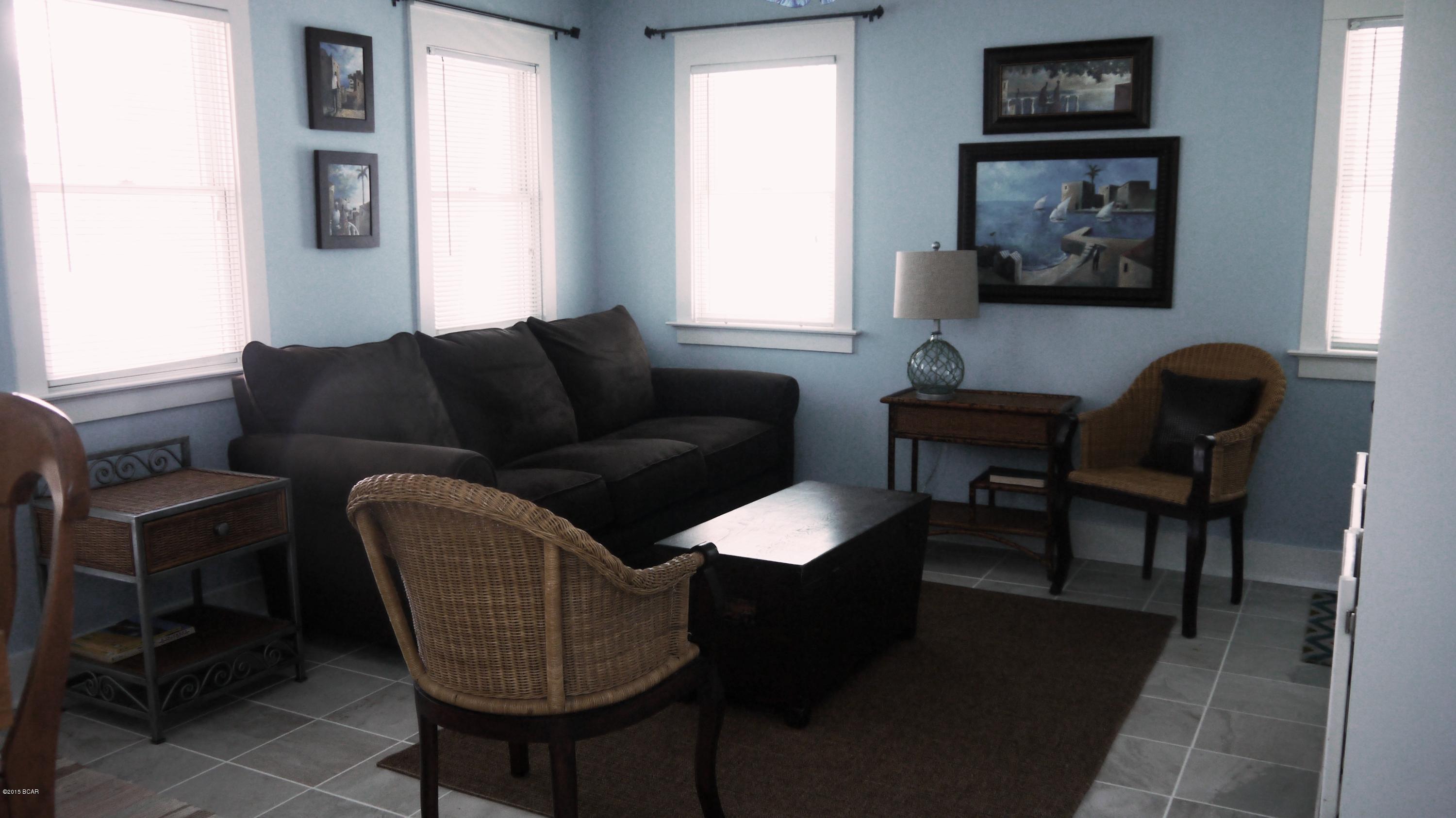 The charming guest house, ''Blissful,'' is located so close to the sugar sands of the Gulf of Mexico that you can hear the waves lapping the shore and smell the salt air as you sit on the front porch or the upstairs balcony.  This guest house has two bedrooms, 2-12/ baths, and an open plan living/dining/kitchen area that opens out onto a large deck overlooking beautiful sawgrass, pine, oak and magnolia trees.  According to the Carillon Beach Design Code, there is ample room on this lot to construct a two story home with 2,400+ square feet of conditioned and porch space or a 2,700+ square foot home with two stories, porches, and a tower with a deck.  This is a must see - great location - great potential.  Use as a family beach retreat, a vacation rental income property or live in the guest house while you built your primary main home on the same​​‌​​​​‌​‌​​​​‌​​‌​​​​‌‌ property.