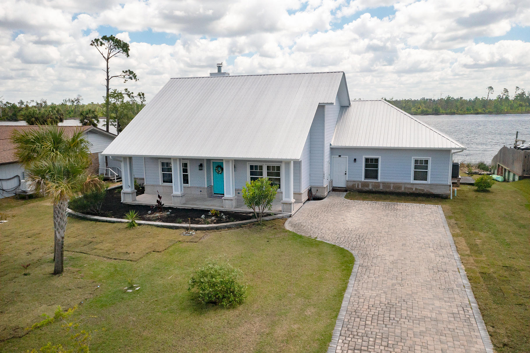 Under contract taking back up's!Amazing waterfront home on Mill Bayou with deep water access to the gulf! Newer built Cape home with 3 bedrooms, 2.5 baths & a huge bonus room(with potential for full bath to be added, seller had pre-plumbed when built). First thing you'll see is the great Southern porches on this home. Enjoy views of the bayou from large covered back deck that includes an outdoor kitchen, with green egg, an oversized pergola & awesome built up flowerbeds. Entering the home you'll see beautiful bamboo flooring throughout the first floor, raised ceilings and a beautifully finished kitchen. It includes all stainless appliances, large 6 burner gas cooktop & a grand island/breakfast bar. The butlers pantry/laundry room boasts plenty of storage & built in washer/dryer. from the master bed and your soaker tub are amazing and serene. Beautiful marble everywhere, this ensuite boasts a double vanity, separate shower and a walk-in closet to die for; finished out with custom built-in storage. Two additional bedrooms in this split floor plan and a separate full bath. Front room as you walk in can be used for an office or a formal dining room.  Backyard is large enough to add an in-ground pool if you would like.  Enjoy gorgeous sunrises in your own private estuary, or take a quick boat ride to the bay and enjoy the sunsets.  Call today for your private tour this one will not last.