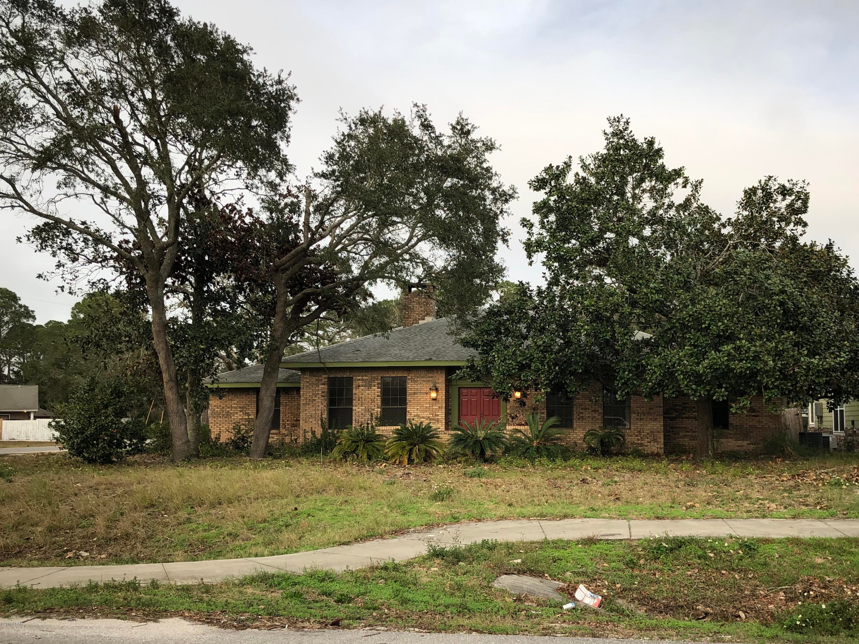 Traditional brick home with a large corner lot. Features a two car garage, central heat and air, 4 bedrooms, 3 baths, family room and formal living and dining room,.  an attached  green house, large outside patio, large lot, outside gazebo. The lot extends approximately 40 feet beyond the back fence according to the seller.