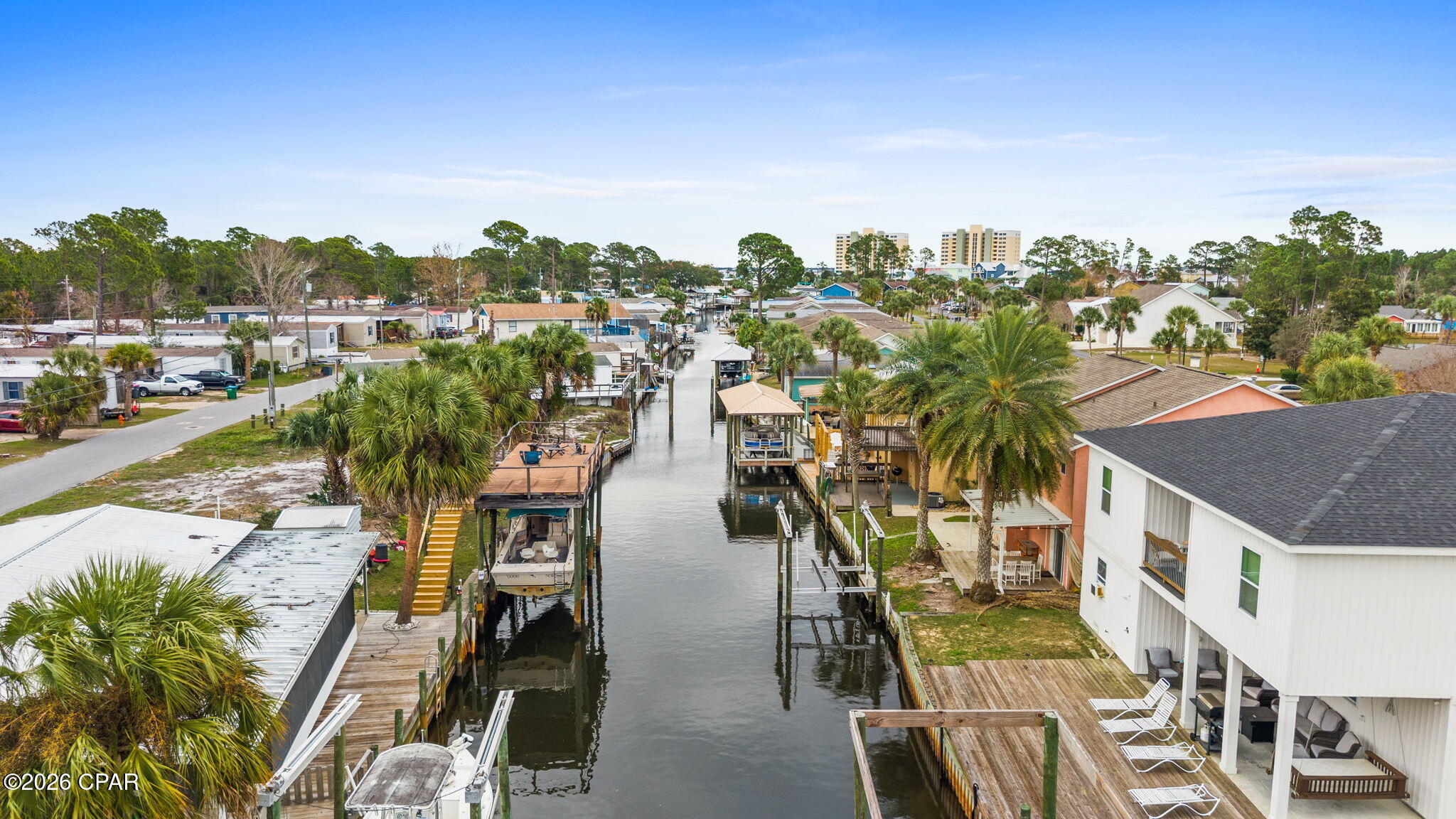 Bring your BOAT!!  Fantastic townhome on the canal!  If you are a boater, you need to come see this home!  There is a new 6000 lb boat lift with remote control and deck.  Just a short boat ride to the bay and the beautiful Gulf!  This 2 bedroom 2 1/2 bath townhome is in a great location.  Close to beaches and also to town.  Stainless appliances, new paint, and new flooring.   The roof was replaced in 2020.  There is a great covered porch for you to sit outside,  enjoy the great breezes and relax while being on the water.  You need to come check out this great townhome and get your boat ready to go fishing or play at shell island!

Buyer to verify all measurements if important.