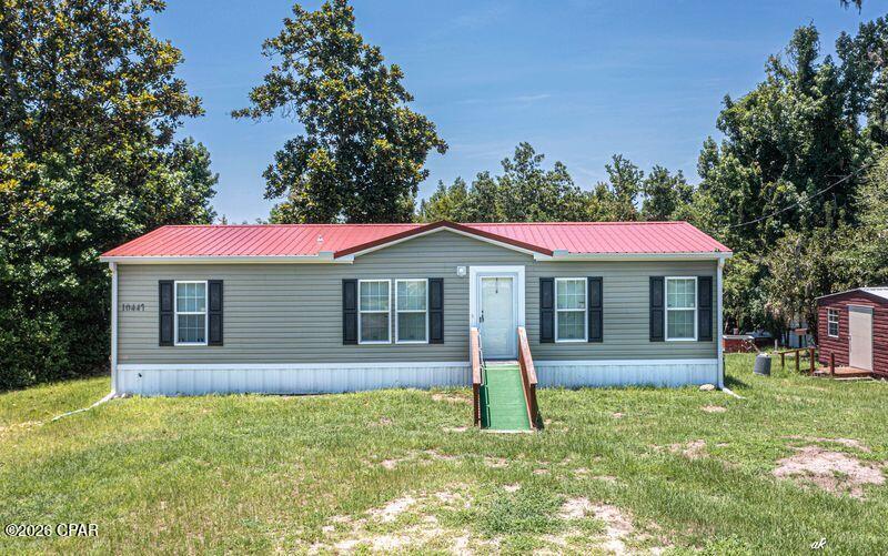 VERY RARE OPPORTUNITY ON ENCONFINA CREEK! This 3 bedroom 2 bath double wide mobile home was Built in 2021 and is in perfect shape! This home boast being waterfront just off of Econfina Creek and Deerpoint lake. Just imagine beautiful sunsets every evening. This home has a new heat pump AC system 2024. The water source is a artesian well,  which is known for some of the best water in bay county. New metal roof 2024 and a new septic tank 2021. Very close the the David Hutchinson park and   boat landing. There is a outdoor grill and fire pit. located in a quite cul-de-sac . Close to grocery store, hardware store and McDonalds and only 30 minutes to the airport . You only limitation is your imagination.