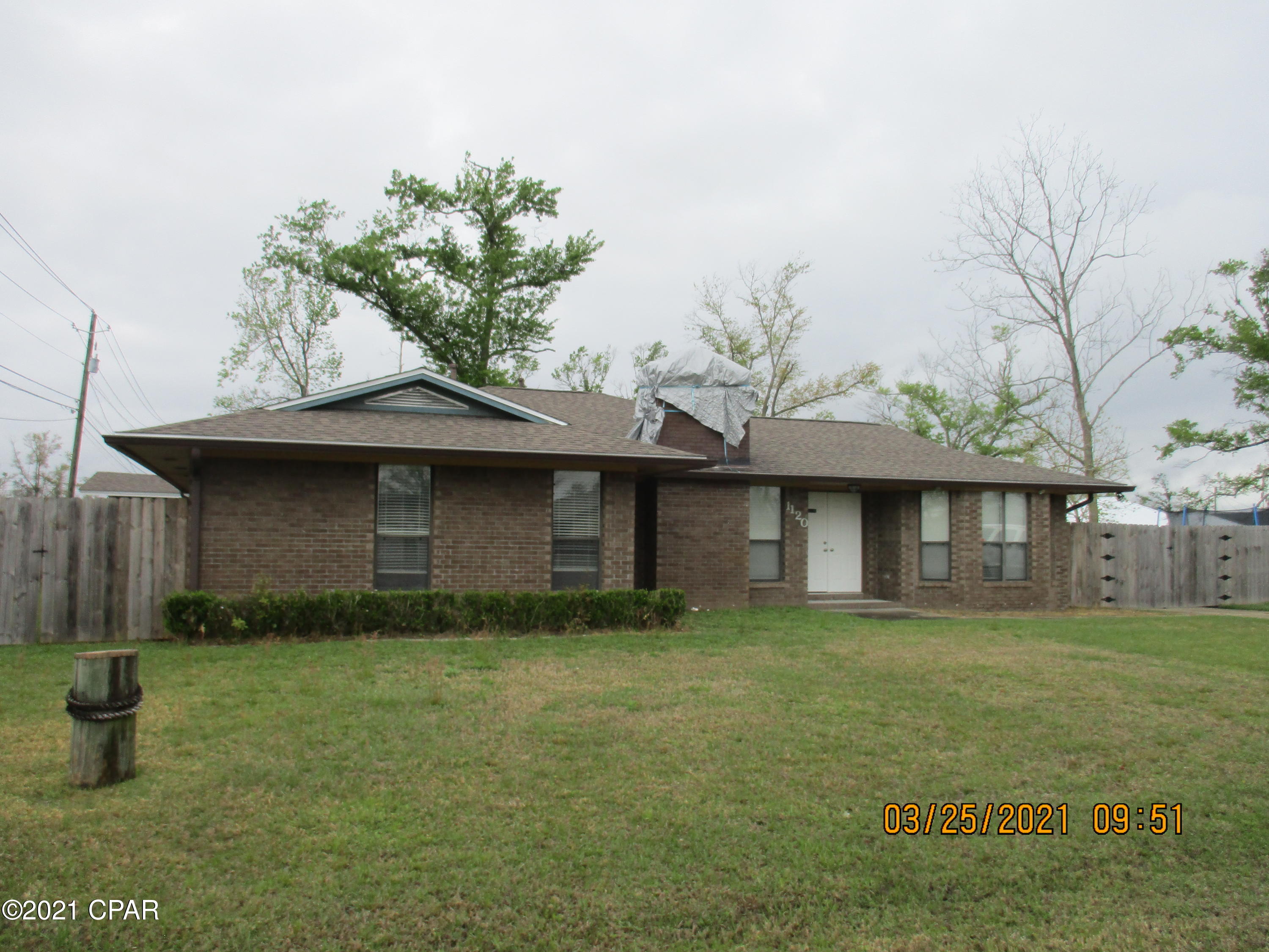 Currently under contract. Seller taking backup offers. LYNN HAVEN.  3/3 brick home renovated and ready to move in.  Enter the tiled foyer, continue to the living room with fireplace and brick hearth.  This nice home features a large kitchen with plenty of cabinets, pantry, island bar, stainless appliances., tile flooring, breakfast area, and spacious dining room.  Master bedroom, bath and walk in closet.  Two guest bedrooms, one with a full bath and a full guest bath.  Double carport with a storage room.  Large fenced backyard with a workshop/shed. Located near the Panama Country Club, restaurants, medical clinics, grocery stores and parks.