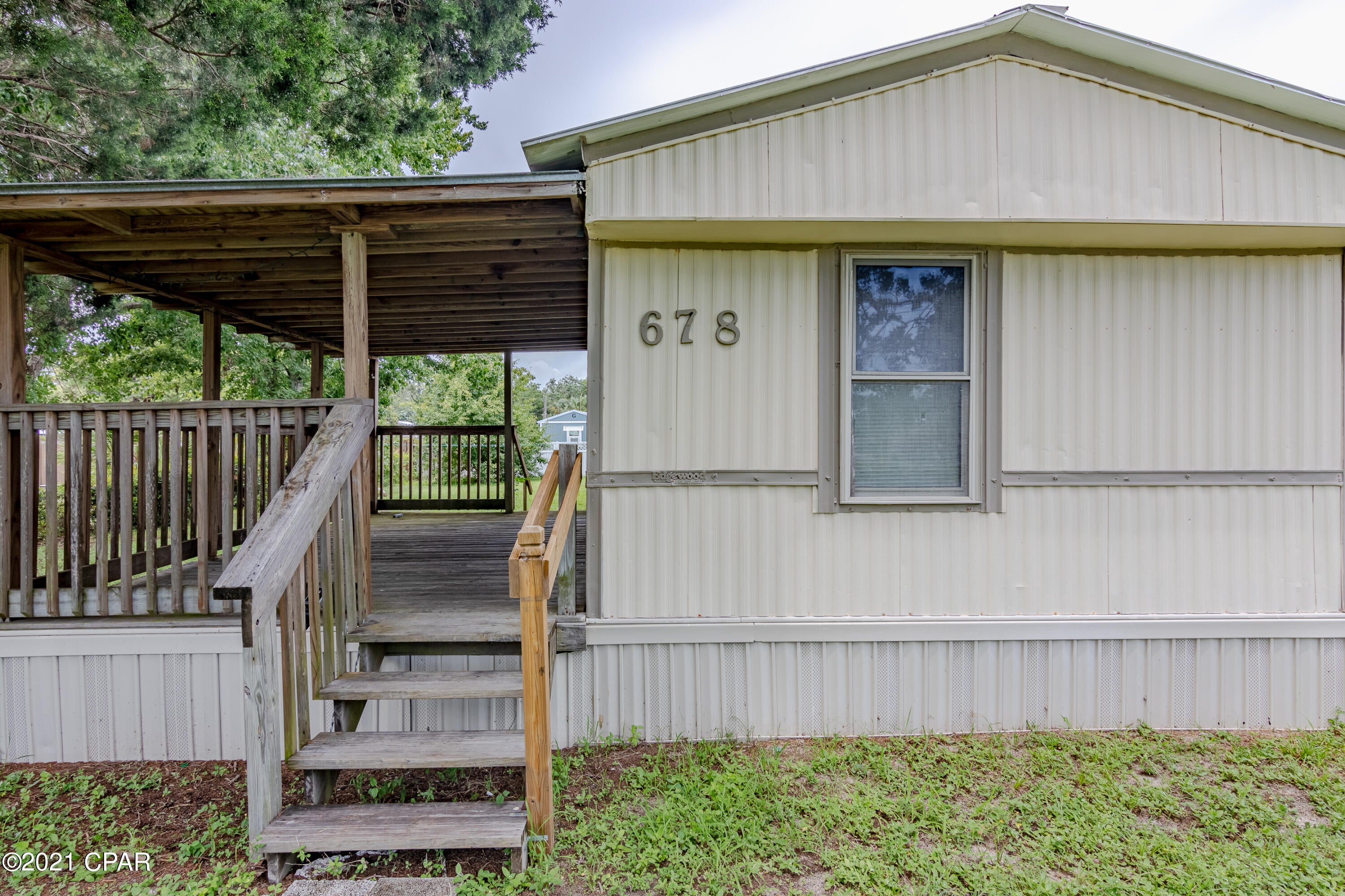 Calling Investors & Bargain Hunters! This mobile home is in need of your expertise & TLC. This mobile home sits on a large and beautiful lot ;located on the West End of Panama city Beach. Priced to allow for repairs. CASH OFFER ONLY!This home has some great features such as a an open living kitchen area, a split bedroom floor plan,a large covered  front  deck ,nice and shaded, a detached, single car garage and No Association fees. Yay! This home would make the perfect get a way or investment piece.

Only a few minutes to Pier Park,the 30A corridor and of course our Beautiful Beach.Come see