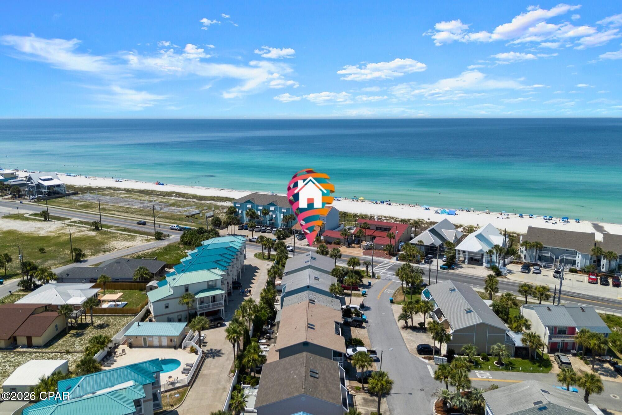 Rare end unit with stunning Gulf views from private balconies off both bedrooms! Located directly across from the beach in the highly desirable Laguna Beach community of Panama City Beach, this beautifully updated 2-bedroom, 2-bath beach cottage offers extra privacy, abundant natural light, and an unbeatable West End location. 
The home is completely turnkey and has never been used as a rental. Inside, you'll find updated cabinets and appliances, granite countertops, custom cabinetry, new furnishings, and thoughtfully designed built-in shelving that conceals the entrance to a spacious storage closet. A custom staircase handcrafted by a master carpenter adds even more character.
The spacious primary bedroom includes a sitting area or office that could easily be converted into a bunk area for additional sleeping space. Both bedrooms open to private balconies with beautiful views of the Gulf.
Villa Chateaus offers a community pool and low HOA dues of only $156 per month. Best of all, you're close to beloved Laguna Beach favorites, including Thomas Donut & Snack Shop and Carousel Supermarket, with the white-sand beach just across the street.
Whether you're searching for a primary residence, second home, or Panama City Beach vacation rental, this rare Laguna Beach end unit offers the location, views, and turnkey condition buyers are looking for. Schedule your private showing at 1 Chateau Road today.