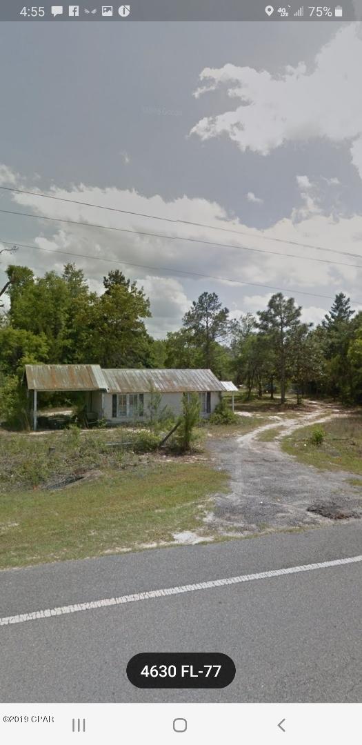 BEAUTIFUL 9 ACRE TRACT WITH GREAT FRONTAGE ON HWY 77 AND CONTINUES DOWN BOISE CIR.  THERE ARE STRUCTURES ON THE PROPERTY BUT ARE NOT GIVEN VALUE.  ONE BUILDING AT THE FRONT OF THE PROPERTY WAS A MECHANIC SHOP. THERE ARE TWO TRAILERS ON THE PROPERTY THAT NEED ATTENTION IF YOU WANT TO USE THEM. WALK BACK THROUGH THE PROPERTY AND FIND BEAUTIFUL HARDWOODS GENTLE SLOPPING LAND.