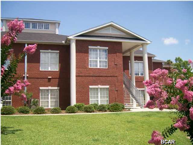 BAYSIDE ESTATES CONDO ... location, location, location! 3/2.5 approx. 2,212 SF condo situated directly on Johnson Bayou across street from St. Andrew's Bay. Only 8 units in this complex ... very private. Large entry opens into LR/Kitchen, 10' ceilings, crown molding, tile & carpet floors, custom cabinets, and large covered balcony overlooking bayou. Large master suite with area for sitting, walk-in closet and large bath. Kitchen has island with sink for washing those veggies and large corner walk-in pantry for storage. Home has 1/2 bath for guests and large laundry room with washer/dryer hookups. Detached 2 car garage with storage room that has separate lock. Just outside your door is a long walkway to dock where you can fish, sun bathe and take your bay boat or wave runner into