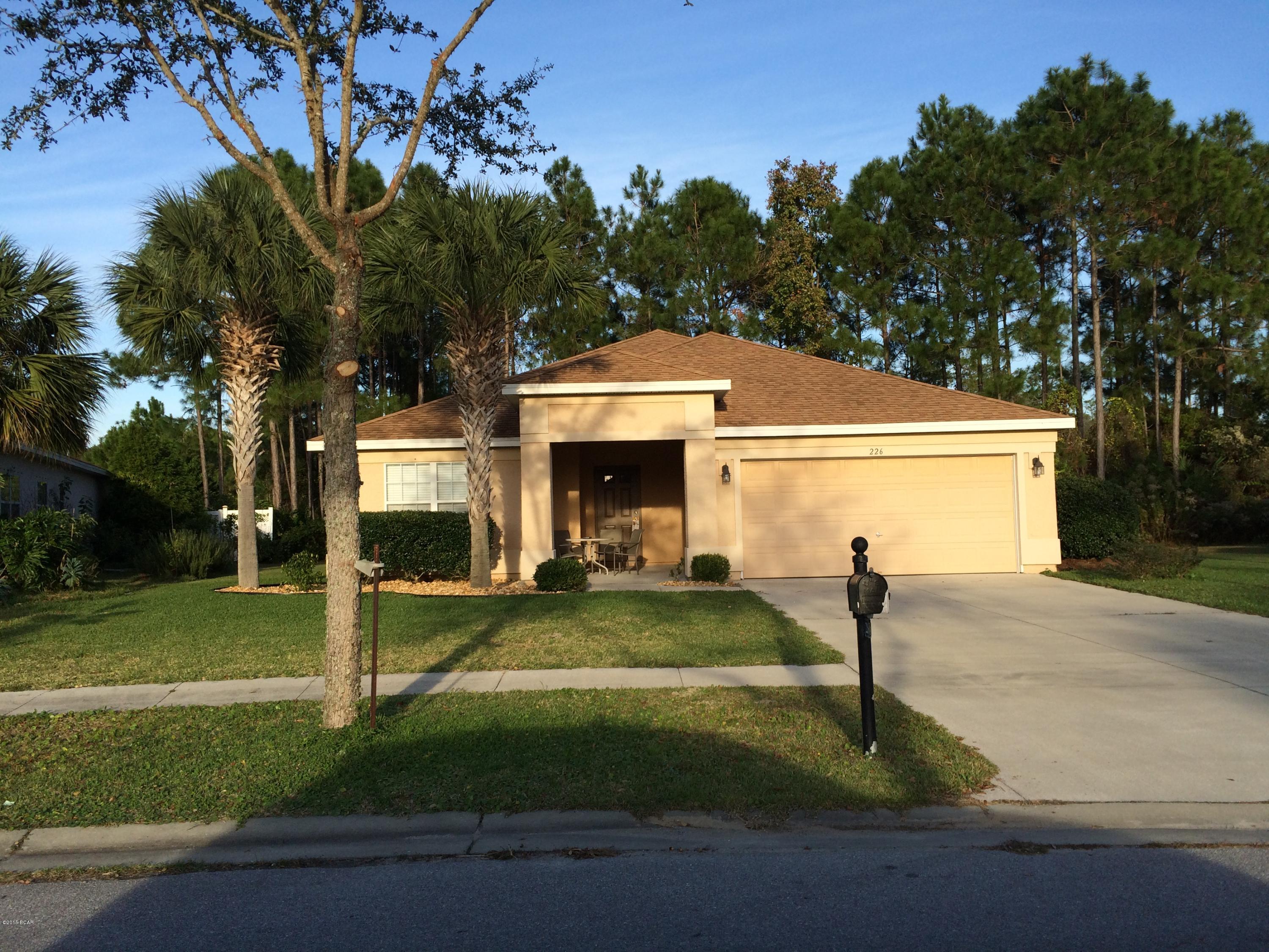 Pier Park Area - 3 bedroom 2 bathroom single family home located in the wonderful community of Palmetto Trace. Cathedral ceiling in the living room area with NEW carpet. Large sliding glass doors open up to a covered patio area. Spacious kitchen has high ceilings, NEW stainless steel appliances, wood cabinets, tile floors,a raised breakfast bar,off kitchen laundry room, and nice size kitchen pantry. The dining room is just off of the kitchen and is tiled for ease of maintenance. All bedrooms have NEW carpet. Entire inside of home has been freshly painted and professionally cleaned. Neighborhood has a fantastic community pool with a gazebo/pavilion, sidewalks, and street lights. Close to beaches, Pier Park, Schools, great dining, grocery stores, Frank Brown Park and more!