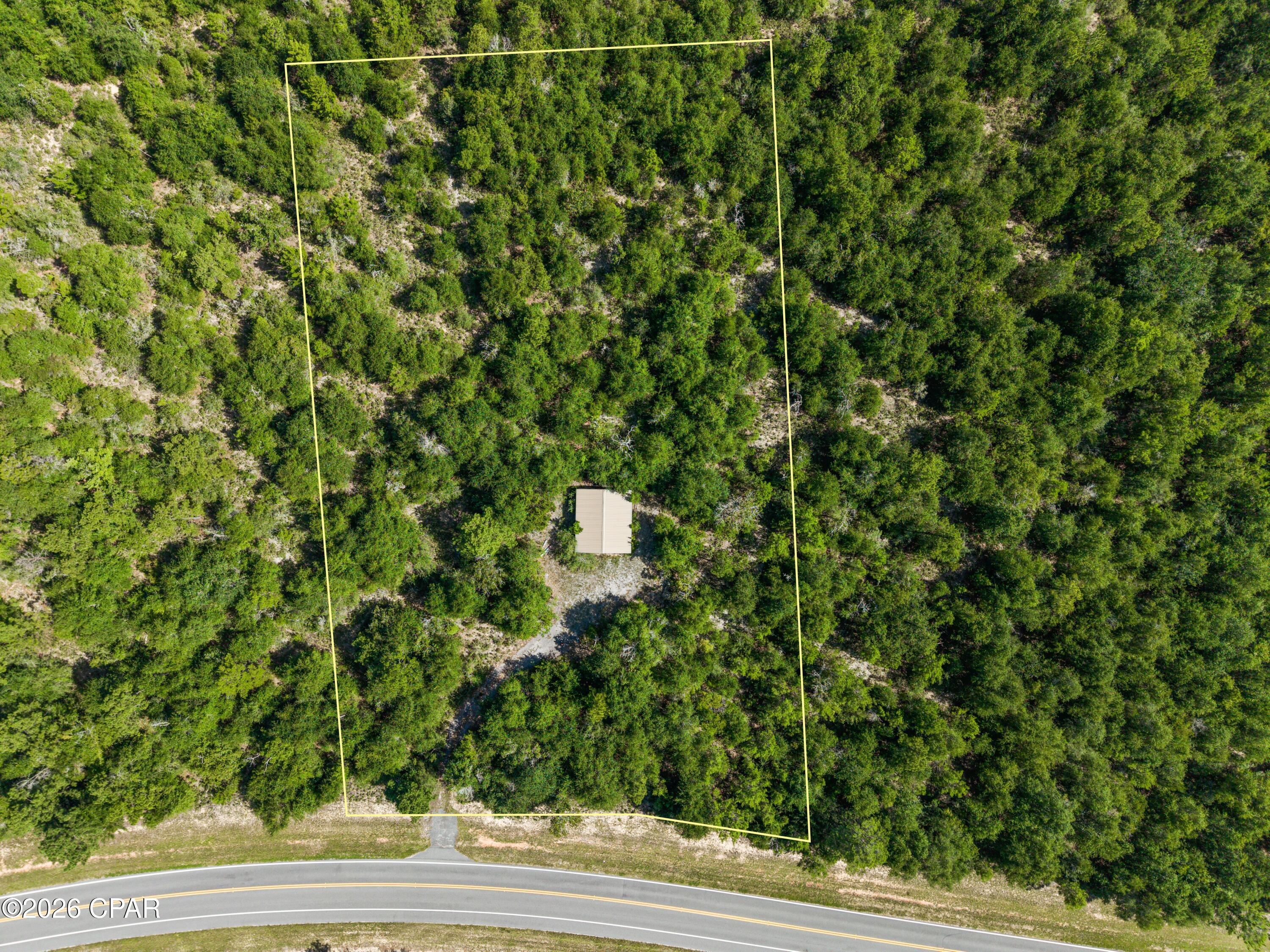 Check out this level lot with a two door garage on over an acre near compass lake! This is the perfect place to store your boat when you come to the lake for the weekend. The cheap annual dues also provide access to local amenities.