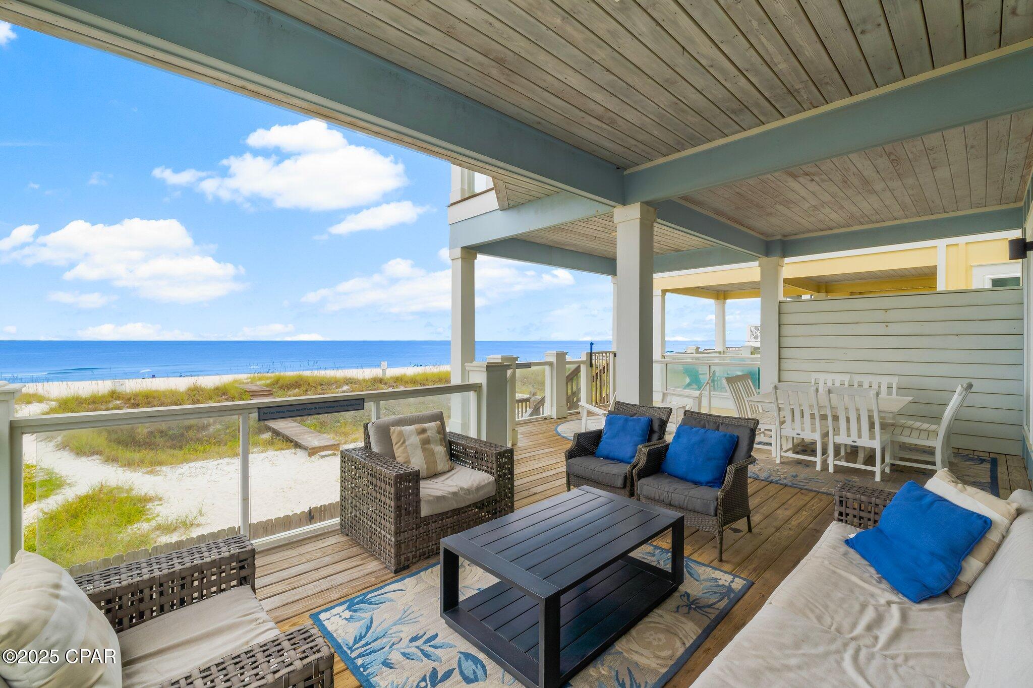 $294K PRICE DROP - 9716 Beach Boulevard, this Gulf-Front is a true masterpiece boasting over $345,000 in rental income for 2024 and on track to be at over $300K for 2025 (based on actuals)! With 3,400 square feet of beautifully designed living space, this 6-bedroom, 6.5-bath residence comfortably accommodates up to 20 guests, making it a lucrative rental opportunity and an ideal family getaway. As you step inside, you'll be greeted by architectural elegance, featuring high ceilings, built-ins, and sleek concrete floors. The exquisite lighting, including chandeliers and recessed fixtures, creates a warm and inviting atmosphere throughout the home. The chef's kitchen is a culinary dream, equipped with a breakfast bar, electric stove, cooktop, dishwasher, and refrigerator, all designed for seamless entertaining. The open layout enhances the flow of the space, making it perfect for gatherings.Step outside to your private oasis, complete with a below-ground pool, a balcony offering stunning endless water views, and a cozy private patio. The fenced backyard is ideal for outdoor gatherings with a dedicated barbecue area. Located within a short distance to world famous restaurants, shopping, and entertainment venues! Experience the best of coastal living in this exquisite property. Schedule a viewing today and make ''Blue Heaven'' your dream home!
