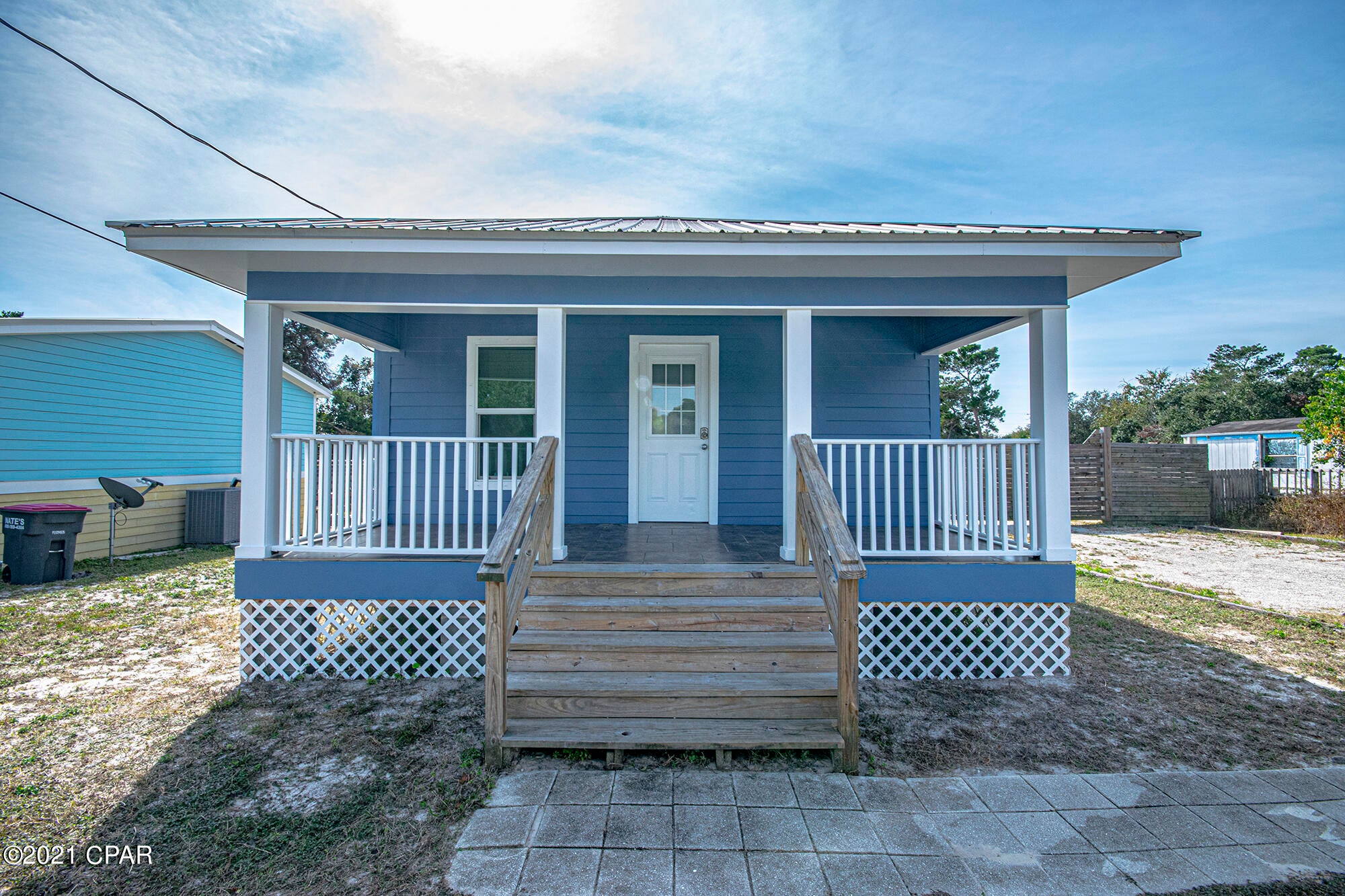 This Cozy Beach Cottage is the perfect private getaway. This bright well-maintained home has 2 bedrooms 1 baths and has 740 sq. ft. of living space on a .27-acre lot. Located on a quiet cul-de-sac road on the west end of Panama City Beach puts you just minutes away from enjoyment at Lake Powell, Pier Park, 30A, and the white beautiful sandy beach! You will be impressed with the 10-foot gated privacy fence that provides plenty of room to store your boat, RV, and the rest of your toys! This would make a fantastic primary residence, second home or investment property!  Call today to get your private tour and see all the BIG possibilities this property offers!