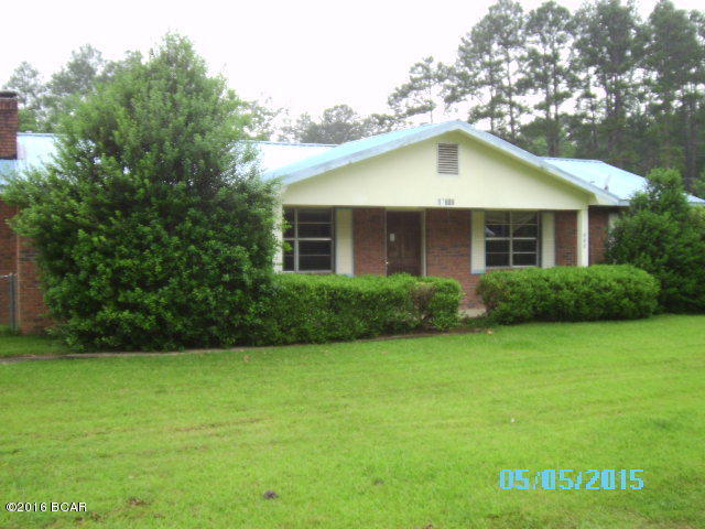 If you are looking for good investment property this is the one for you. It is a brick home on a nice corner lot with great potential! It has 3 bedrooms, 2 baths, a large living room with a fireplace. There is a screened in back porch and an open covered patio area. There is a detached 1 car garage/workshop. Nice location convenient to all local amenities in this nice country town with lots to offer.