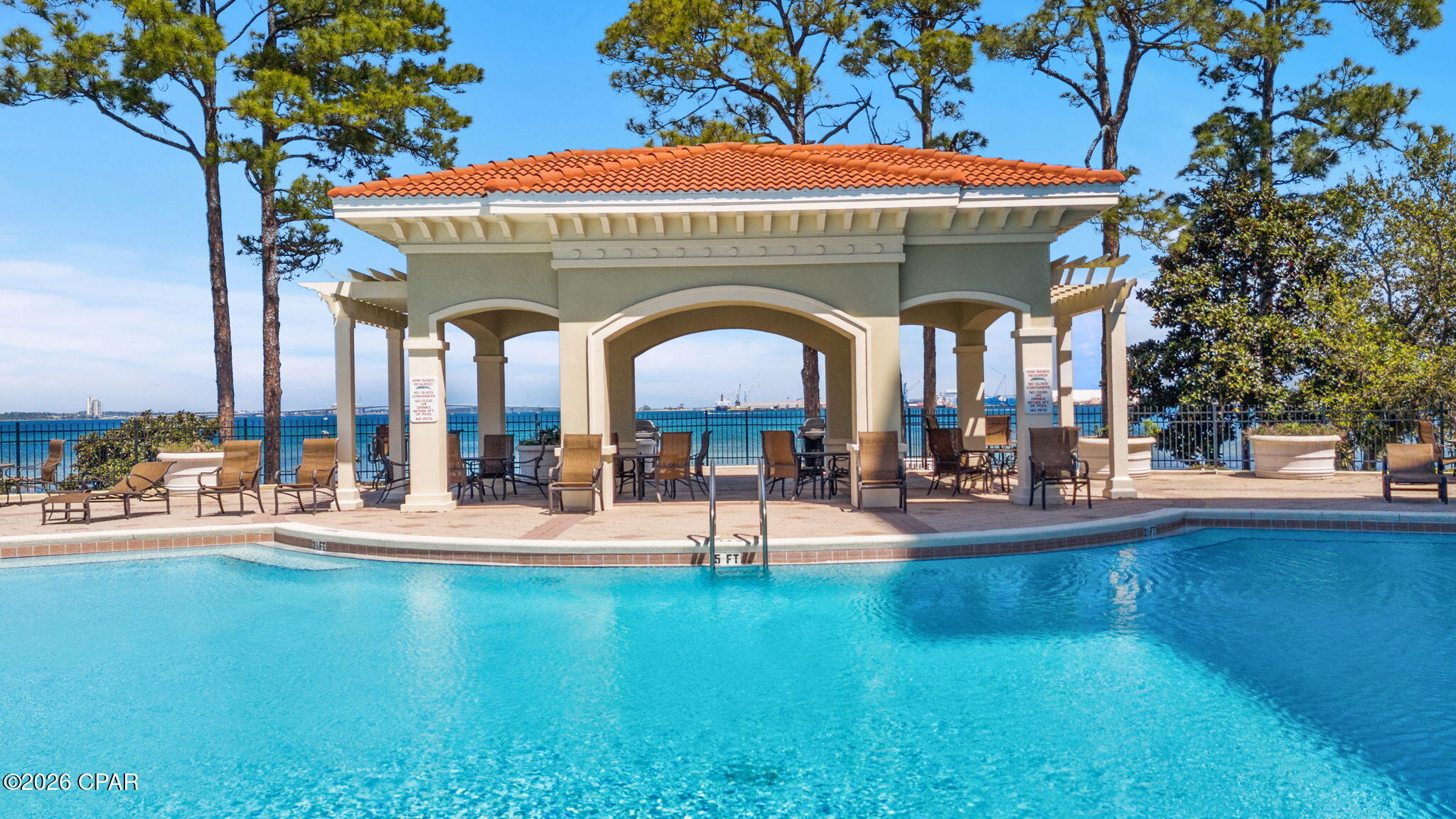 HUGE price improvement for a piece of Paradise!! Magnolia Bay Club is the epitome of a relaxed Florida lifestyle. From the gated entry to the manicured entrance road with swaying palm trees to the beautiful fountains that guide you home; this is what you have been looking for! Welcomed in by a foyer hall leading back to a top floor 10th story view of the Bay, the bright and airy living room with crown molding and tile floors makes a perfect respite from the cares of the day. This large open floor plan makes living easy with the dining room just off of the kitchen and eat-in bar with granite countertops and SS appliances. Double entry doors open into the master bedroom entry foyer and into a bright en suite with double vanities, a jetted tub and standup shower. Just off that is the walkin closet and bedroom with an extra large slider onto the roomy balcony. It's just here, when you know that you have embraced the Florida lifestyle looking over the fantastic, open Bay. Back inside, the entry foyer opens up to two additional bedrooms; one with it's own full bath and walkin closet. The other bedroom has pocket doors and walkin closet, making this room extremely versatile and could double as an office or playroom, as well as guestroom. Outside, the Florida lifestyle continues with a beautiful, waterfront pool, kayak/canoe launch, bike racks, walking paths and a community room with a gym and restrooms convenient to the pool. The secure aspect of the gated entry and covered parking bring a layer of comfort so you can enjoy what you came here for! No short term rentals allowed in this complex, as well. Long term rental only. This is one to put on your list and make sure you see!