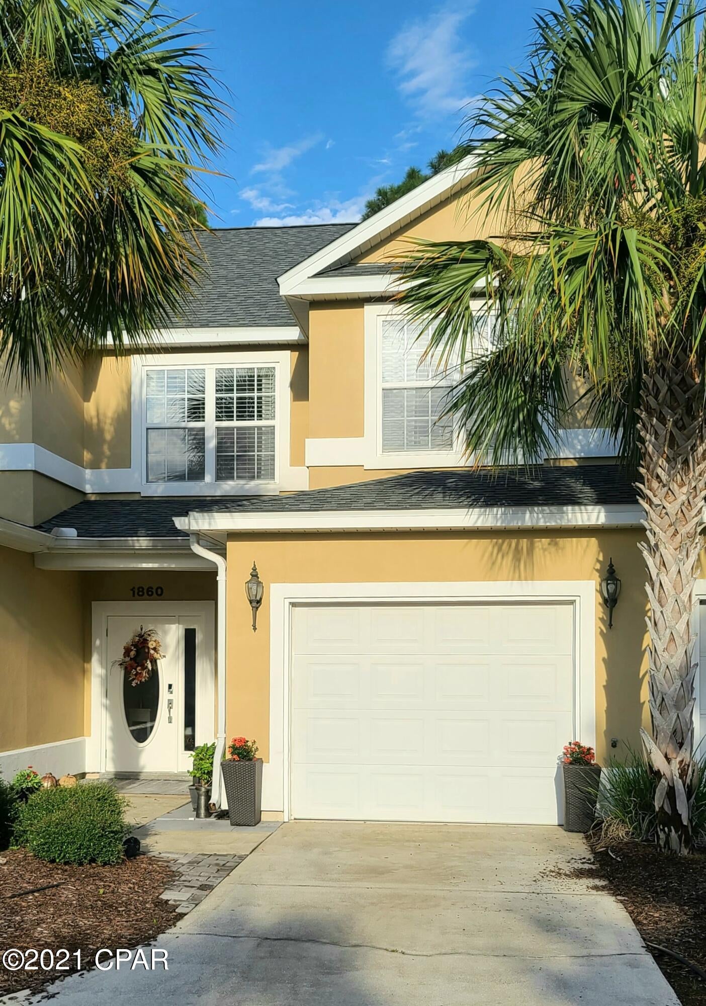 Looking for low maintenance easy coastal living in a gated community? This is it! Come see this well maintained, beautiful and spacious 3BR/2.5BA townhouse with garage, located directly across from the pool and fitness center, and backing up to a natural vegetative buffer. Home shows like new with granite countertops, travertine backsplash, kicksplash, upgraded kitchen cabinets, and gorgeous smudge proof slate GE appliances.  Living room and kitchen feature upgraded wood look tile flooring and 9' ceilings. New carpet upstairs in all bedrooms and master bedroom has walk-in closet. Beautiful upgraded tile work with marble tile floors and glass tiles on walls in bathrooms. Open the french doors to your private extended patio with pavers, and invite your friends over to BBQ! Roof, exterior paint, and gutters are less than two years old. AC is less than 5 years old. Appliances are less than 5 years old and washer and dryer included with accepted offer! Annabella's is a gated community in Panama City Beach, centrally located to schools, shopping, restaurants, and a short drive to the beach or Panama City. This home is turn key, and ready for a new owner! Life is short, buy the beach house!