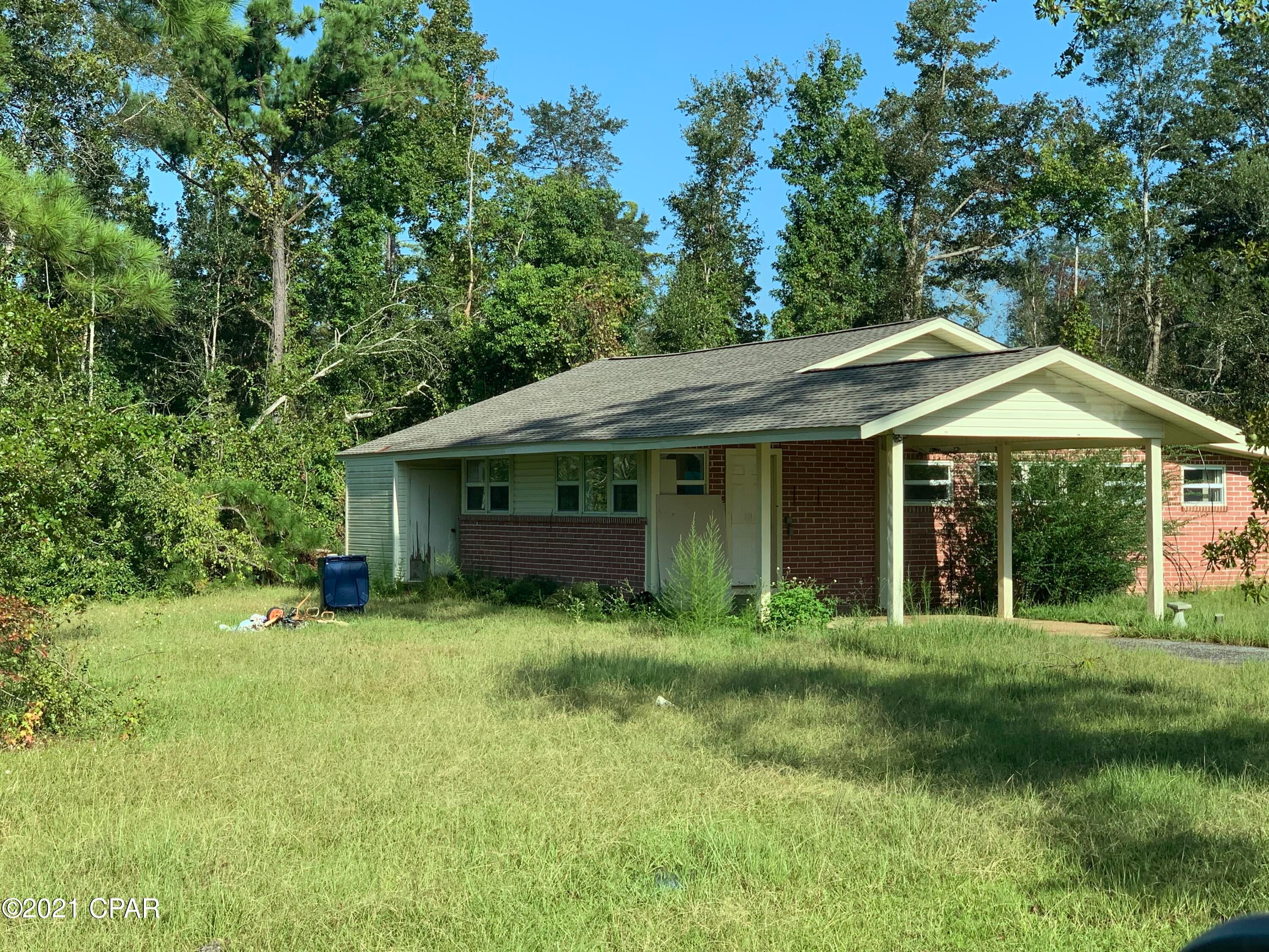 Long driveway dead ends at this cute 3BR/2BA brick home. Hardwood floors, new roof, and newer windows.  Would be great for a first time home buyer or someone looking to flip.  House needs a little work, but has so much potential.  Call today, this won't last long.