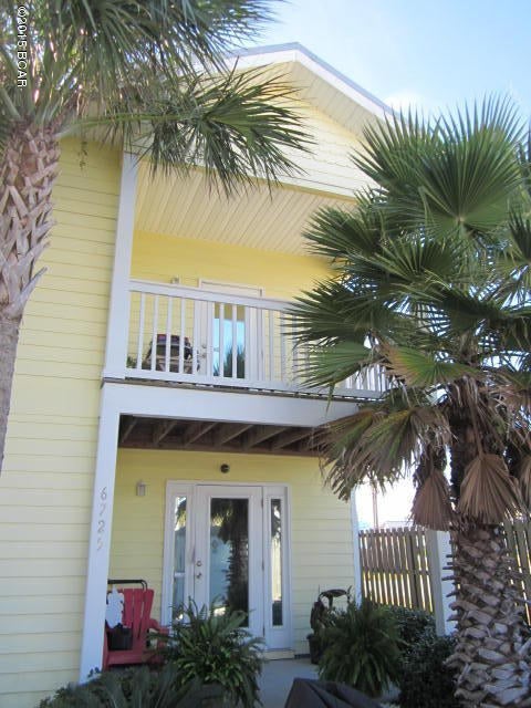 Beautiful 2 story townhome only a couple blocks to the beach in small 12 unit subdivision with pool. This home has 2 large and spacious master suites each with full bath and walk-in closets and private entrances with covered patios. One Master Suite is only about 15 steps to the pool. Washer/Dryer hook ups downstairs with some storage underneath the stair area.  Upstairs boasts high 12 ft ceilings and open spacious living area. There is Ceramic tile in all the wet area's and carpet in the living area's. Balcony overlooking the Pool and Balcony off the kitchen. For your convenience there is a 1/2 bath upstairs. The kitchen is spacious with a large walk-in pantry. The Seller has added a Mini-Split AC/Heat pump to keep the upstairs cool and it saves on Energy bills. A must see!