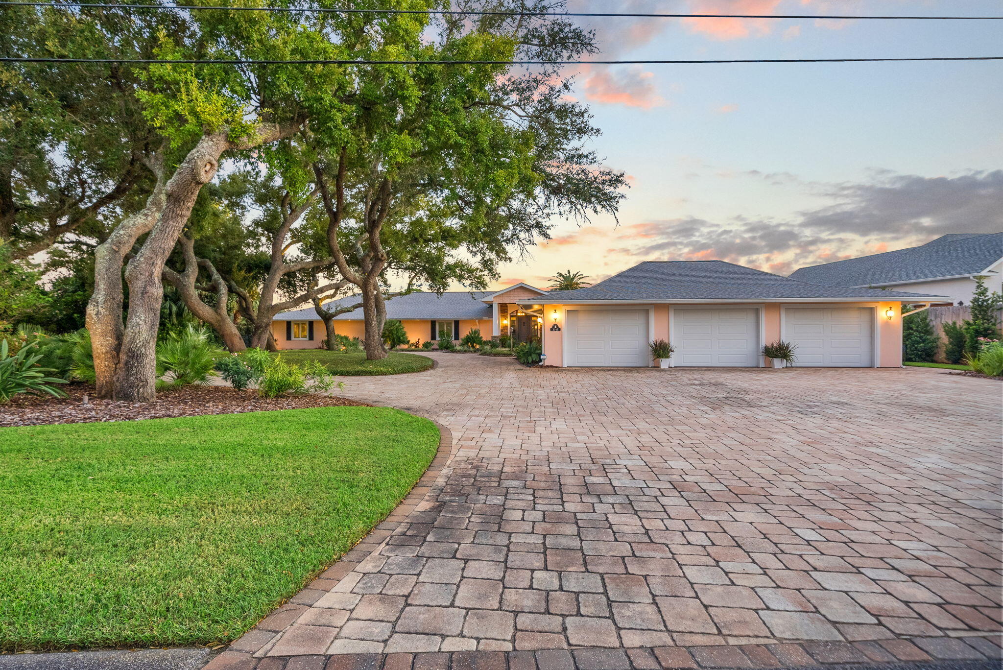Experience the ultimate in waterfront living with this exquisite single-story 4-bedroom, 3.5-bath bayou-front estate. Perfectly positioned on a generous .79-acre lot with 156 feet of pristine waterfront, this 4,152 sq. ft. home blends modern luxury with serene coastal charm. Inside, the open-concept design showcases a gourmet chef's kitchen outfitted with Sub-Zero and Wolf appliances, two large sink areas, granite countertops, and seamless flow into the dining and living spaces — all enhanced by breathtaking water views. The master suite, living room, dining area, and kitchen each capture the beauty of the bayou, creating a light-filled retreat where every day feels like a vacation.