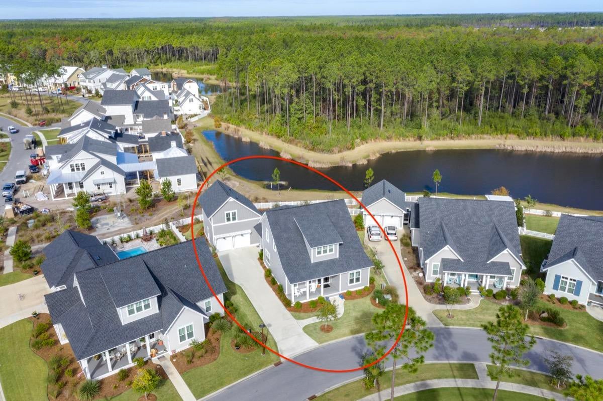 Meticulously maintained and beautifully designed Custom Home. Situated on the bend of a serene pond in the back and a community park in the front in a construction complete area of Origins, this is truly an incredible opportunity to own the quintessential Florida home. When you first walk in, you will immediately notice the ten foot ceilings, how bright, welcoming and eloquent this home really is. Every detail was obsessed over and the list of upgrades is longer than a summer night. In the master, you'll revel in the morning light as it soaks into the shiplap accent wall and pours into the gorgeous quartz floors and countertops of the master bathroom. Featuring upgraded Honeycomb marble flooring in the shower, quartz walls, a garden tub, dual vanity and an expansive walk-in closet. Across the hall in the guest bedroom, there is again a shiplap accent wall, an upgraded which has been implemented throughout the entire home. Upgraded basket weave tile in the showers as well as upgraded bathroom flooring, quartz countertops and Koehler toilets and sinks. In the main area of the home you're first greeted by a proper dining area and an expansive living area. In the kitchen there is upgraded cabinetry to the ceiling, quartz countertops, Thermador stove and dishwasher, Subzero fridge and Sharp drawer microwave. Upstairs there is an easterly facing bonus room or office space with two additional bedrooms with ensuite bathrooms on either side. However, if you're looking for somewhere more secluded for your guests, take a trip back downstairs, past the kitchen and laundry room and up the stairs to the carriage house. A private and self sustainable location with a full bath. You will also see a magnificent quartz wet bar with a built-in wine cooler. Out back, there is a large screened-in patio overlooking the pond with a stone BBQ area and a completely fenced in backyard. With a 2 car garage, ample driveway space, 5 bed, 5 bath and an unparalleled location, this is the ideal home for entertaining, big families or those who just simply love their space.

Watersound Origins homeowners are able to access the fitness center and seasonally heated community pool, as well as dock access at neighboring Lake Powell. Watersound Origins also connects to the Panama City Beach Conservation Park via a 5-mile long trail. Watersound Origins offers plenty of options for the nature and beach lovers alike! Spend your days kayaking, paddle boarding, biking, running or walking along the Watersound trail. Located a short distance from Scenic Highway 30A there are endless dining, event and local shopping options and attractions.

Owners in WaterSound Origins may also have the opportunity to join the St. Joe Beach Club featuring private beach access, beach services, 2 pools, 2 restaurants and a bar with gulf views along with 2 private Golf Courses, Camp Creek Golf Course and Sharks Tooth Golf Course. Please inquire with membership for more info and latest offerings.