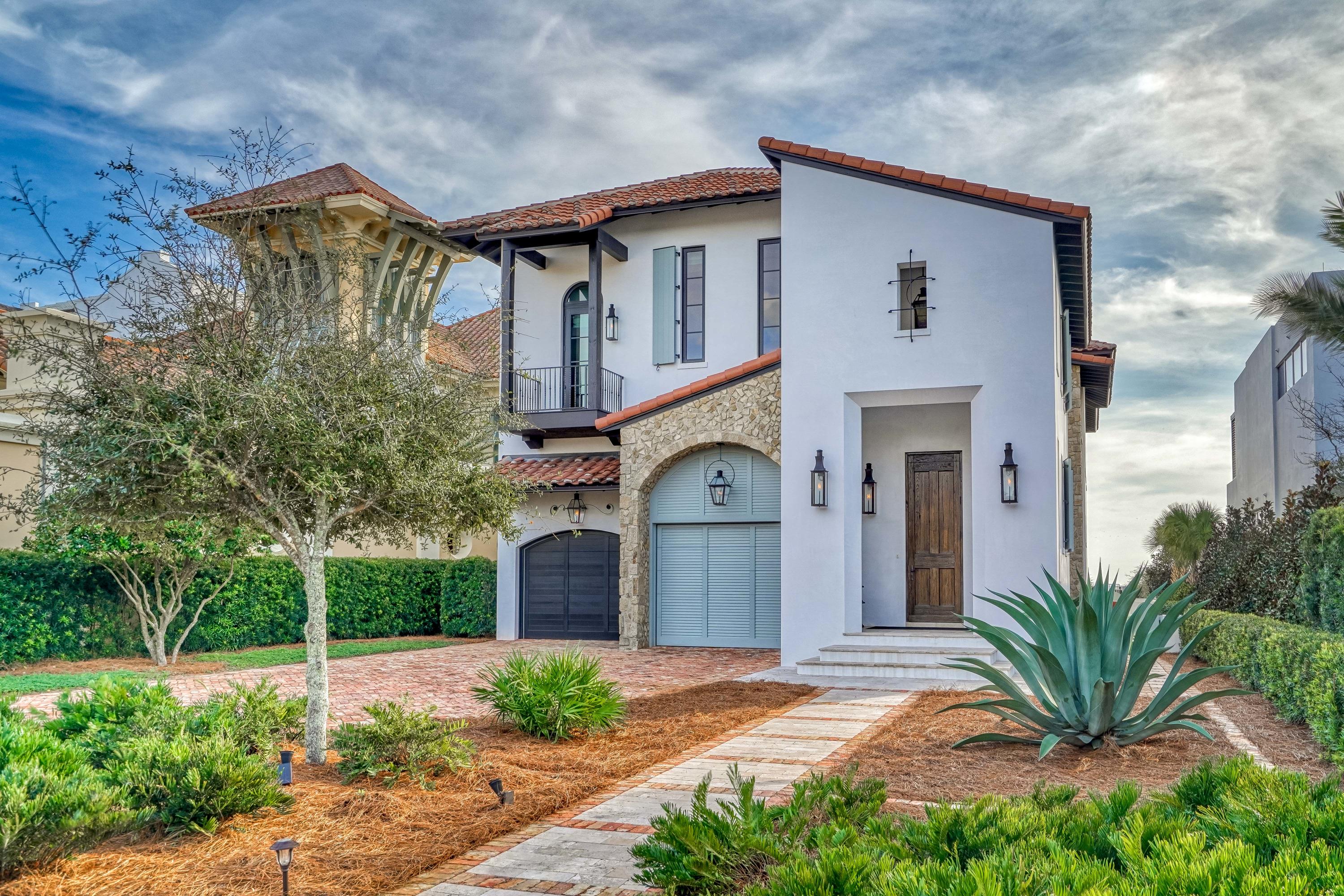 ''SANDCASTLE IN PARADISE'' is a gorgeous TUSCAN VILLA in PARADISE BY THE SEA- A true EXCEPTION IN PRIVACY, this property is a GATED COMPOUND located within a GATED COMMUNITY. 60'' OF GREAT GULF VIEWS, INFINITY EDGE POOL w LOGGIA. A large den has a FIREPLACE & WET BAR perfect for entertaining. A MASTER SUITE on 1st floor overlooks the GULF. 2 GUEST SUITES on 1st Floor. The interior STONE WALLS & BEAMED VAULTED ceilings make you feel like you really are in TUSCANY! The GULF FRONT LIVING AREA is massive with kitchen, dining & Living Room all having fabulous views! The MASTER SUITE opens onto a private balcony with the best WESTERN views... perfect for SUNSET viewing! MARBLE bath, large walk-in shower, free-standing soaking tub, water closet & bidet, and walk-in closet create a SPA like feel. Turn off of Florida's Gulf Coast Scenic HIGHWAY 30-A to find this GEM; where the homes are as distinguished as the beaches are IMPECCABLE. There's a reason why the area has been coined as "FLORIDA'S BEST KEPT SECRET" by FORBES. Glimmering waters and sparkling white sand resembles that of international destinations, providing the perfect backdrop for a life reimagined. While many refer to the area as the HAMPTONS OF THE SOUTH, it may come as a surprise that along the dunes of South Walton there is more to behold than Traditional Coastal Architecture. It seems very common for people to dream of life by the sea or of spending their days relaxing in a Villa in Tuscany... but what may have not occurred to them is that it is possible to have the BEST OF BOTH WORLDS. Under the Tuscan Sun, bodegas and farmer's markets provide organic wines, olive oil, farm-fresh produce and other local delicacies. On Scenic Highway 30A, the same amenities are in abundance along with Gulf-to-table Dining and Seafood.

      AT ''SANDCASTLE IN PARADISE'',  12' CEILINGS on 1st floor & 14' on 2nd floor create an open and elegant living space. An ELEVATOR that loads from the garage makes getting cargo to the 2nd floor LIVING AREA so EASY. The interior STONE WALLS & BEAMED VAULTED ceilings make you feel like you really are in TUSCANY! There is another GUEST SUITE upstairs with a private balcony overlooking the motor court. This bedroom shares a HUGE bath with the OFFICE (Office can be converted into 6th bedroom is desired) EXPANSIVE FLOOR LENGTH WINDOWS provide fabulous GULF VIEWS throughout the house. The combination of FABULOUS FINISHES is breathtaking...reclaimed wooden floors and beams, stone interior walls, venetian plaster walls, waterfall island & marble countertops, etc., etc.

There is even a "dog court" on the western side of the home. Designed by DARRELL RUSSELL,AIA, ASID,of BOHEME DESIGN,this home was built to the HIGHEST STANDARDS & DESIGN DETAILS. This ''SANDCASTLE IN PARADISE'' has 5722 sq ft , 2 car oversized conditioned garage (679 sq ft), and 1894 sq ft of GULF FRONT DECKS & PORCHES! PRIVACY IS A PRIORITY HERE with your own GATED COMPOUND within a GATED COMMUNITY. Owner will have a long, beautifully landscaped drive to the home. There is plenty of room to add a CARRIAGE HOUSE over the garage if wanted. (Lot is 60' x 617') Palm-lined driveway leads to DOUBLE GARAGES, one oversized for SUVs and one for your beach convertible. . A FORTIFIED home built to the most current standards to WITHSTAND WINDS UP TO 162 mph. This will make your insurance more affordable as well as your peace of mind that this HOUSE IS A FORTRESS!